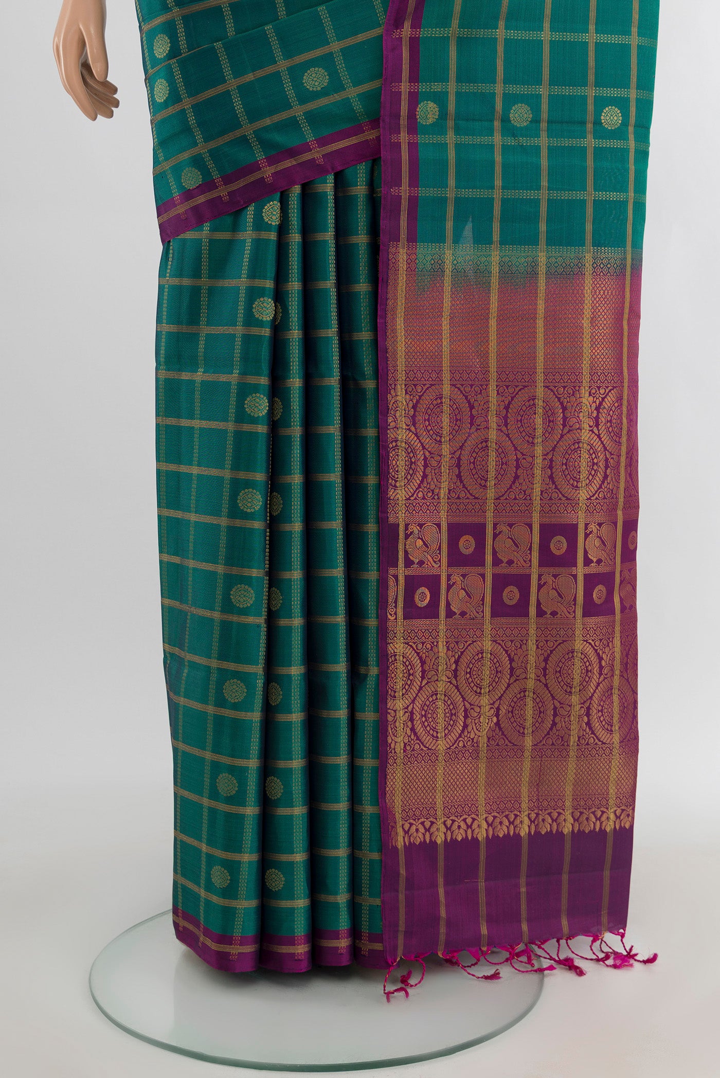 Pleats and pallu of Peacock Blue Soft Silk Saree with Checked design on the body and Without Border. 