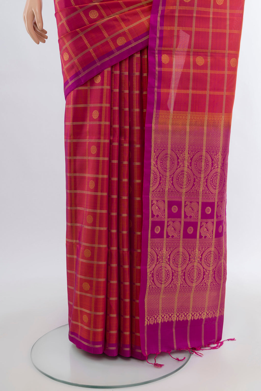 Pleats and pallu of Peach Soft Silk Saree with Zari Butta on the body and Silk Border. 