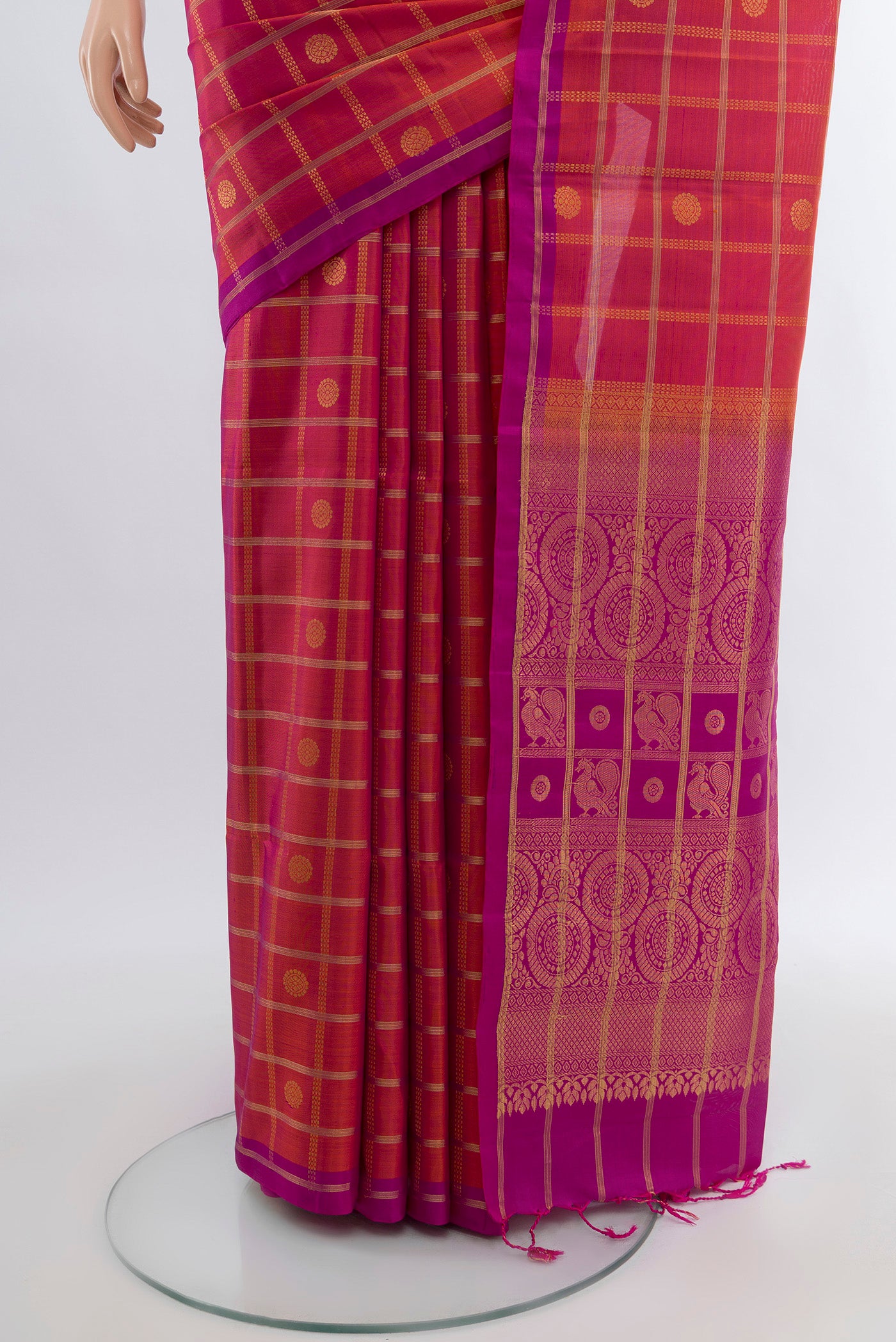 Pleats and pallu of Peach Soft Silk Saree with Zari Butta on the body and Silk Border. 