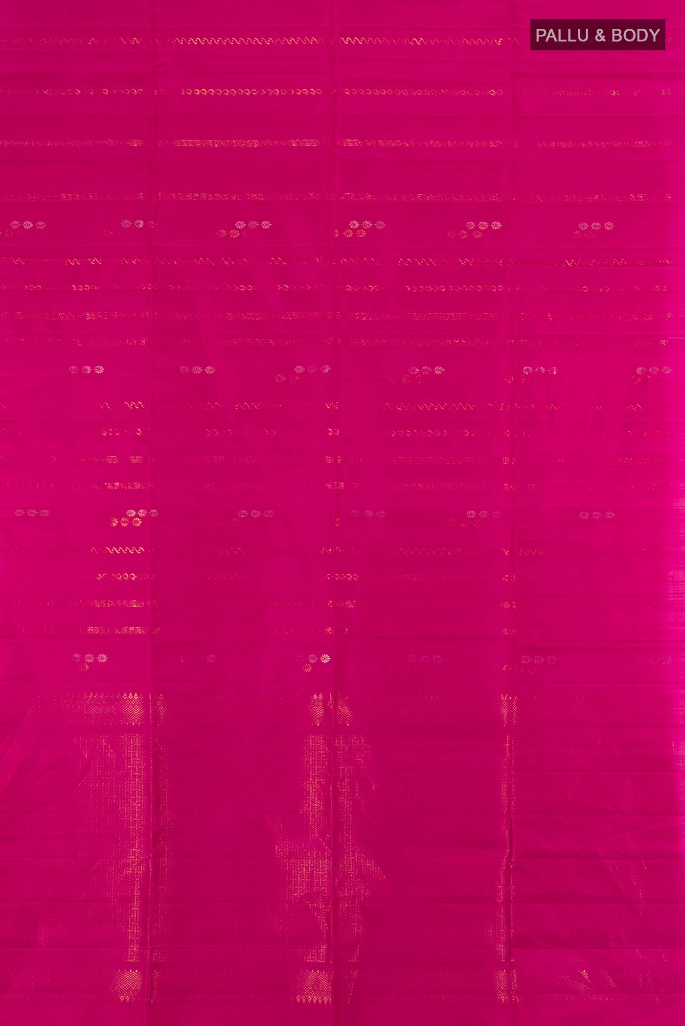 Flat view of Rani Pink Soft Silk Saree with Zari Butta on the body and Without Border. 