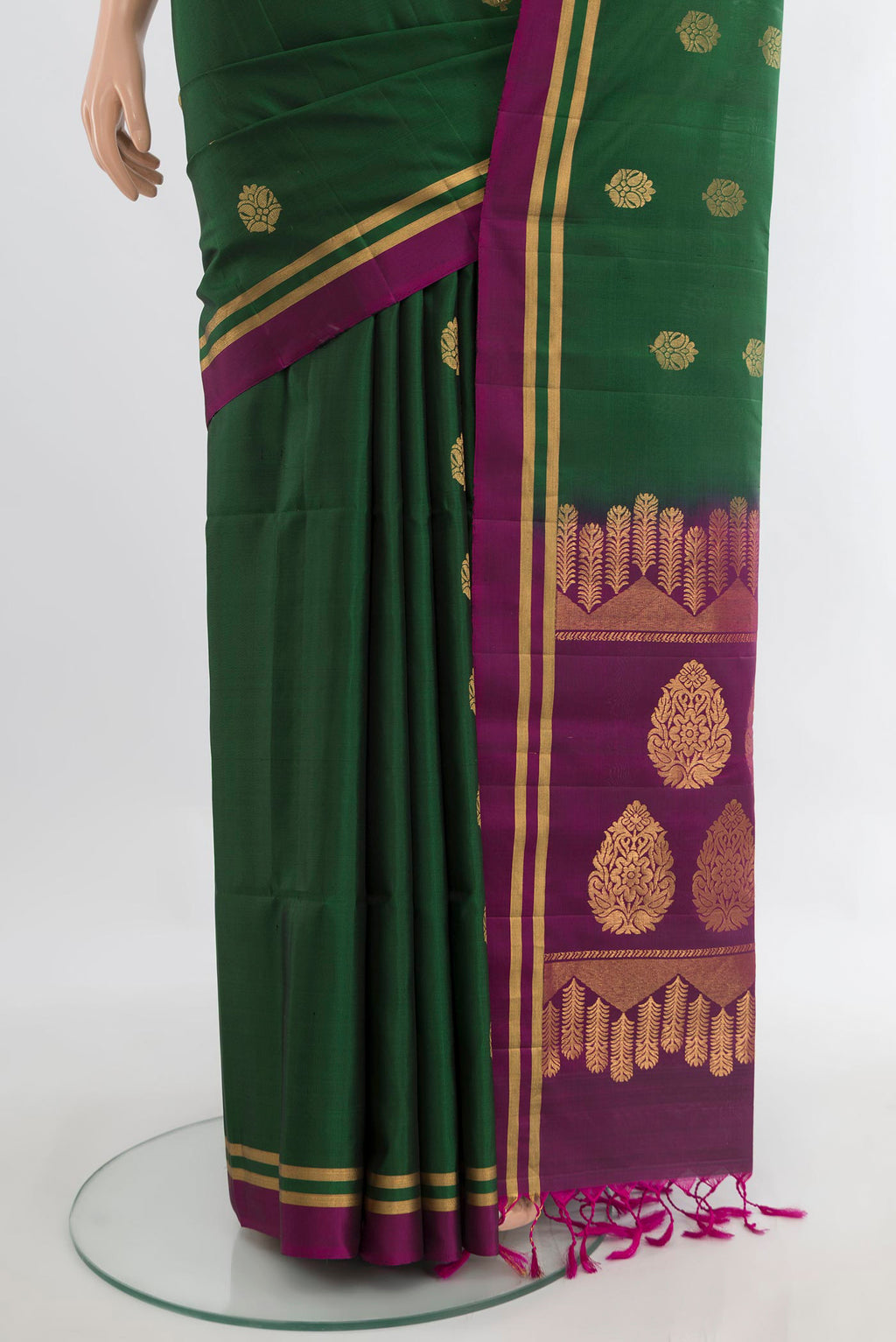 Pleats and pallu of Pure Silk Green Soft Saree with Zari Butta on the body and Plain Border. 