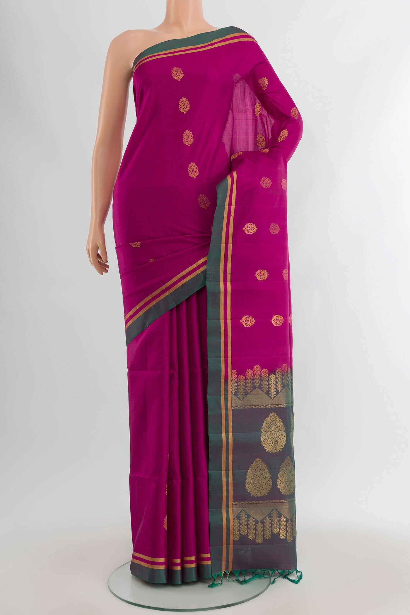 Light Magenta Soft Silk Saree with Zari Butta on the body and Plain Border.  displayed on a mannequin