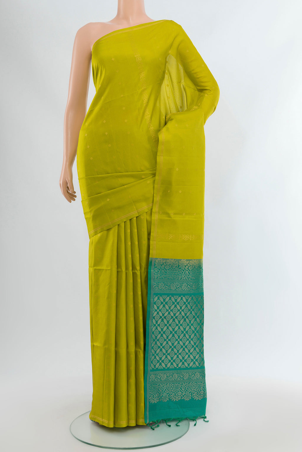 Parrot Green Soft Silk Saree with Zari Butta on the body and Without Border.  displayed on a mannequin
