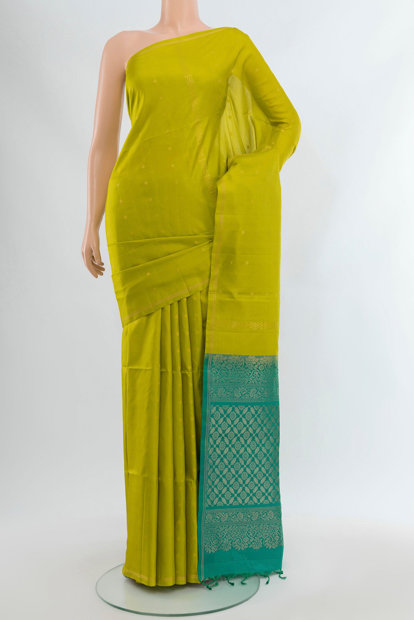 Parrot Green Soft Silk Saree with Zari Butta on the body and Without Border.  displayed on a mannequin