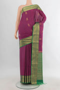 Pure Silk Maroon Soft Saree with Zari Butta on the body and Zari Border.  displayed on a mannequin