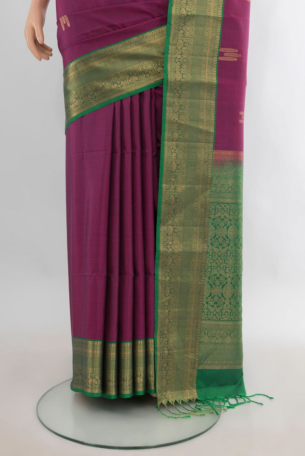 Pleats and pallu of Pure Silk Maroon Soft Saree with Zari Butta on the body and Zari Border. 
