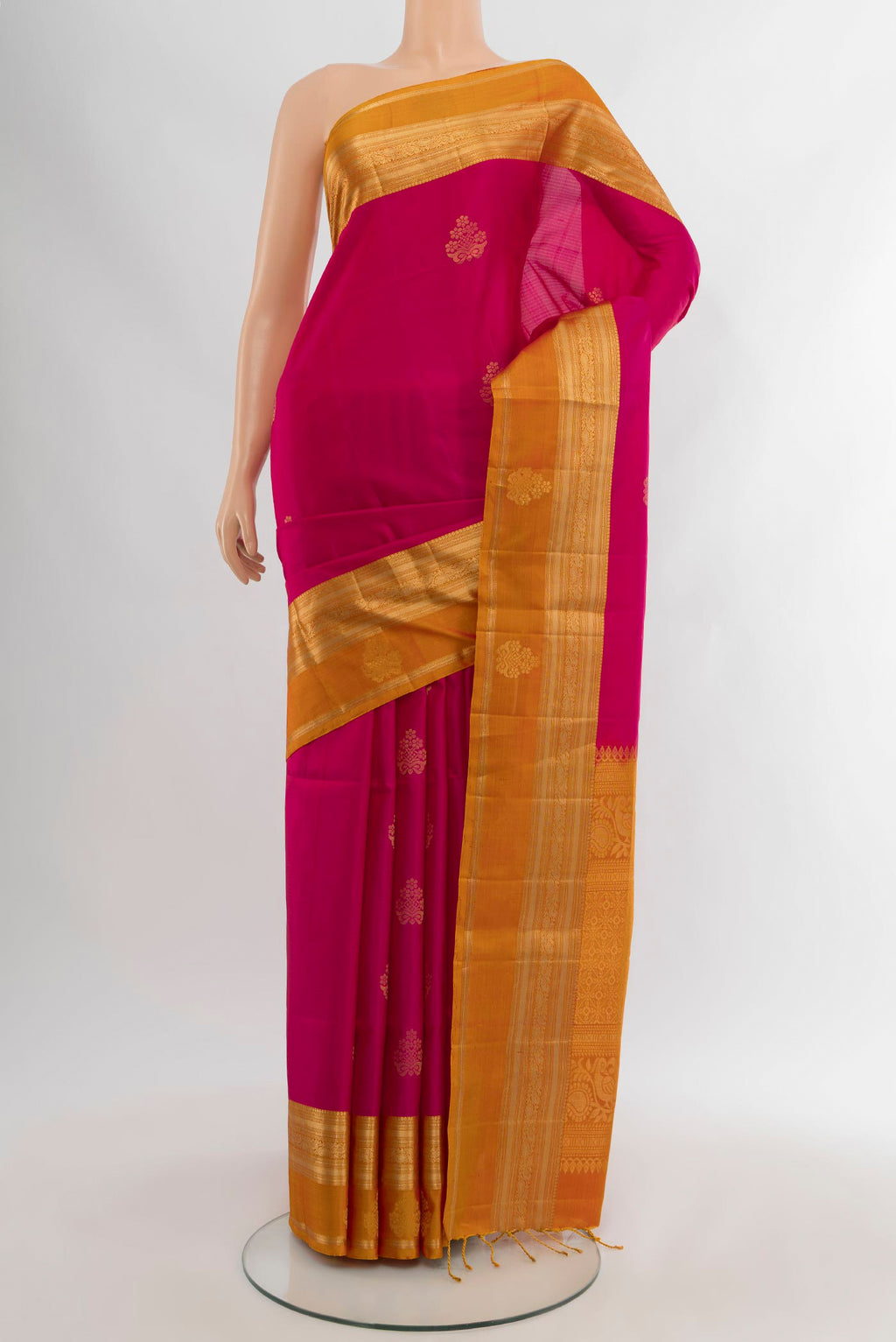 Pink Soft Silk Saree with Zari Butta on the body and Zari Border.  displayed on a mannequin