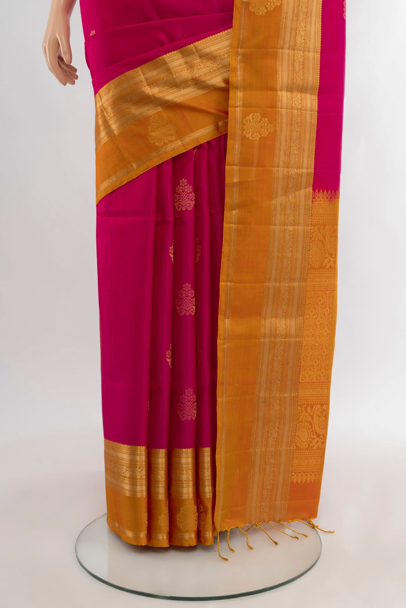 Pleats and pallu of Pink Soft Silk Saree with Zari Butta on the body and Zari Border. 