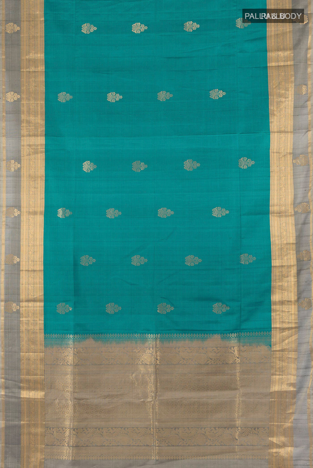 Flat view of Pure Silk Teal Soft Saree with Zari Butta on the body and Zari Border. 
