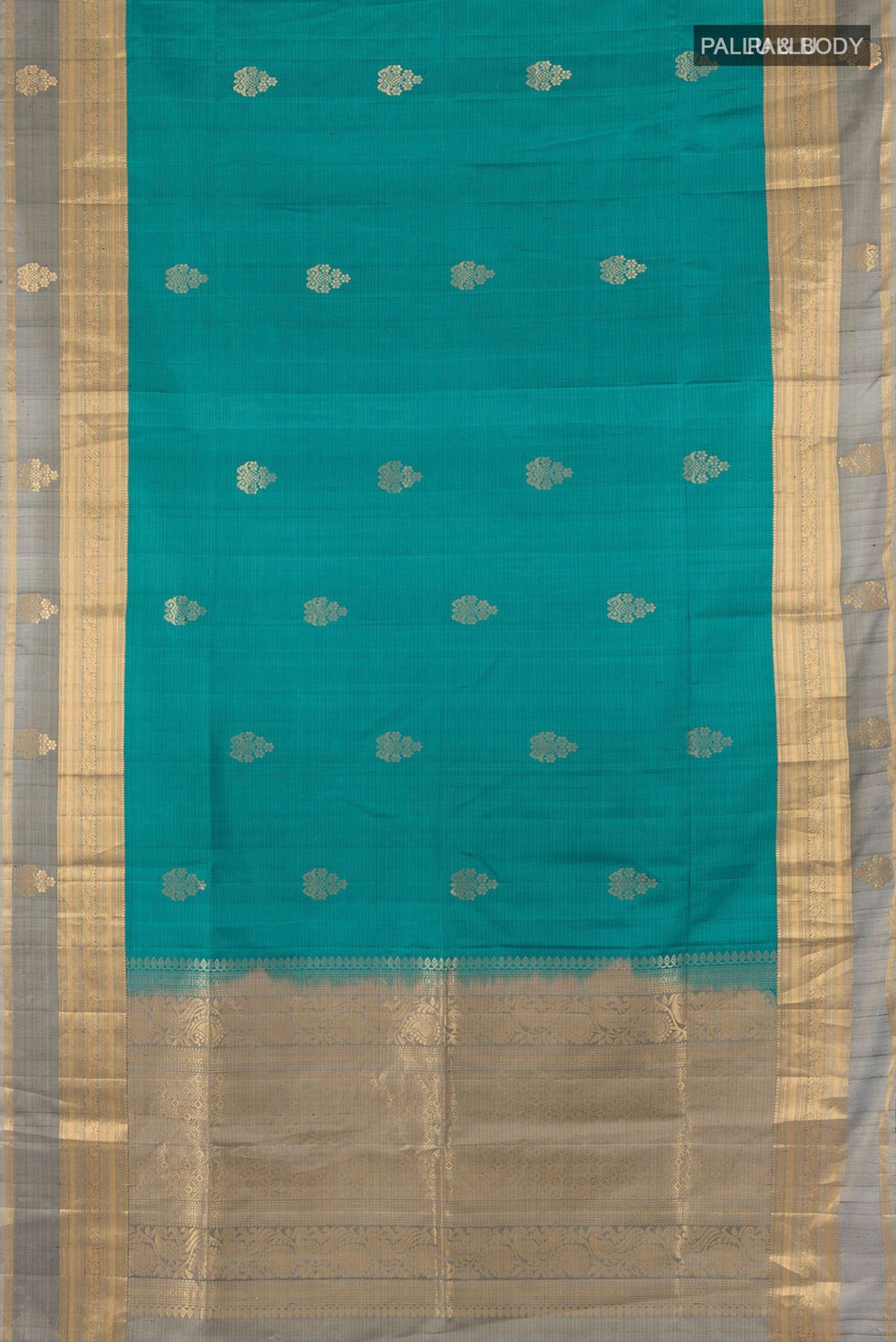 Flat view of Pure Silk Teal Soft Saree with Zari Butta on the body and Zari Border. 
