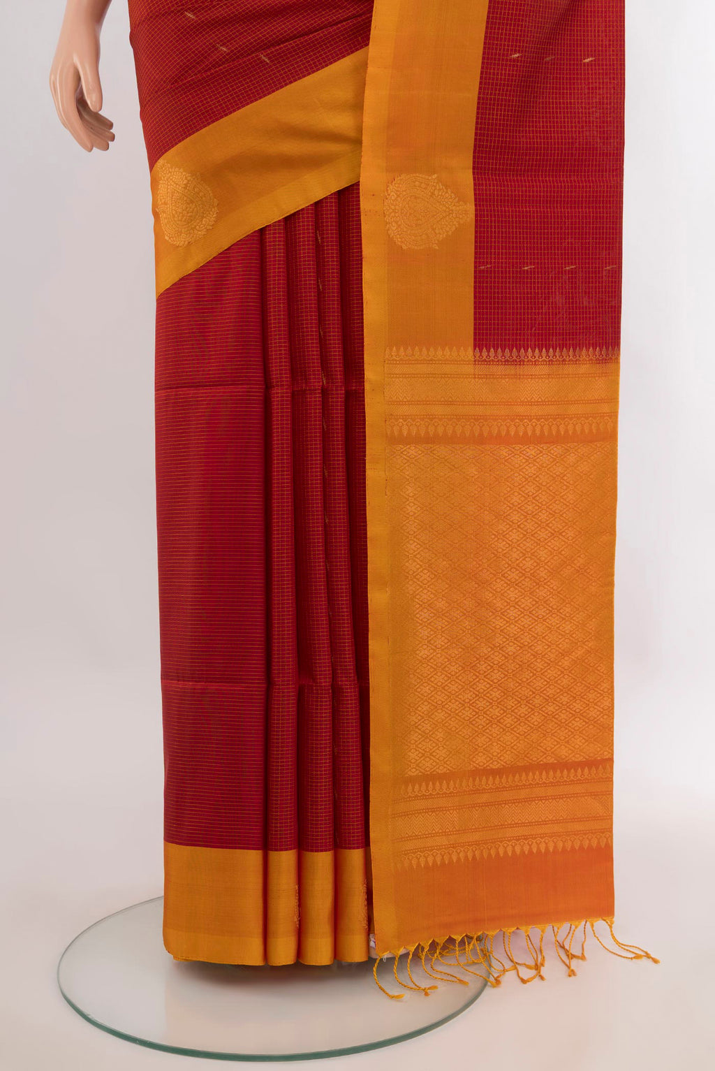 Pleats and pallu of Pure Silk Red Soft Saree with Zari Butta on the body and Zari Border. 
