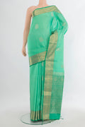 Pure Silk Sea Green Soft Saree with Zari Butta on the body and Zari Border.  displayed on a mannequin