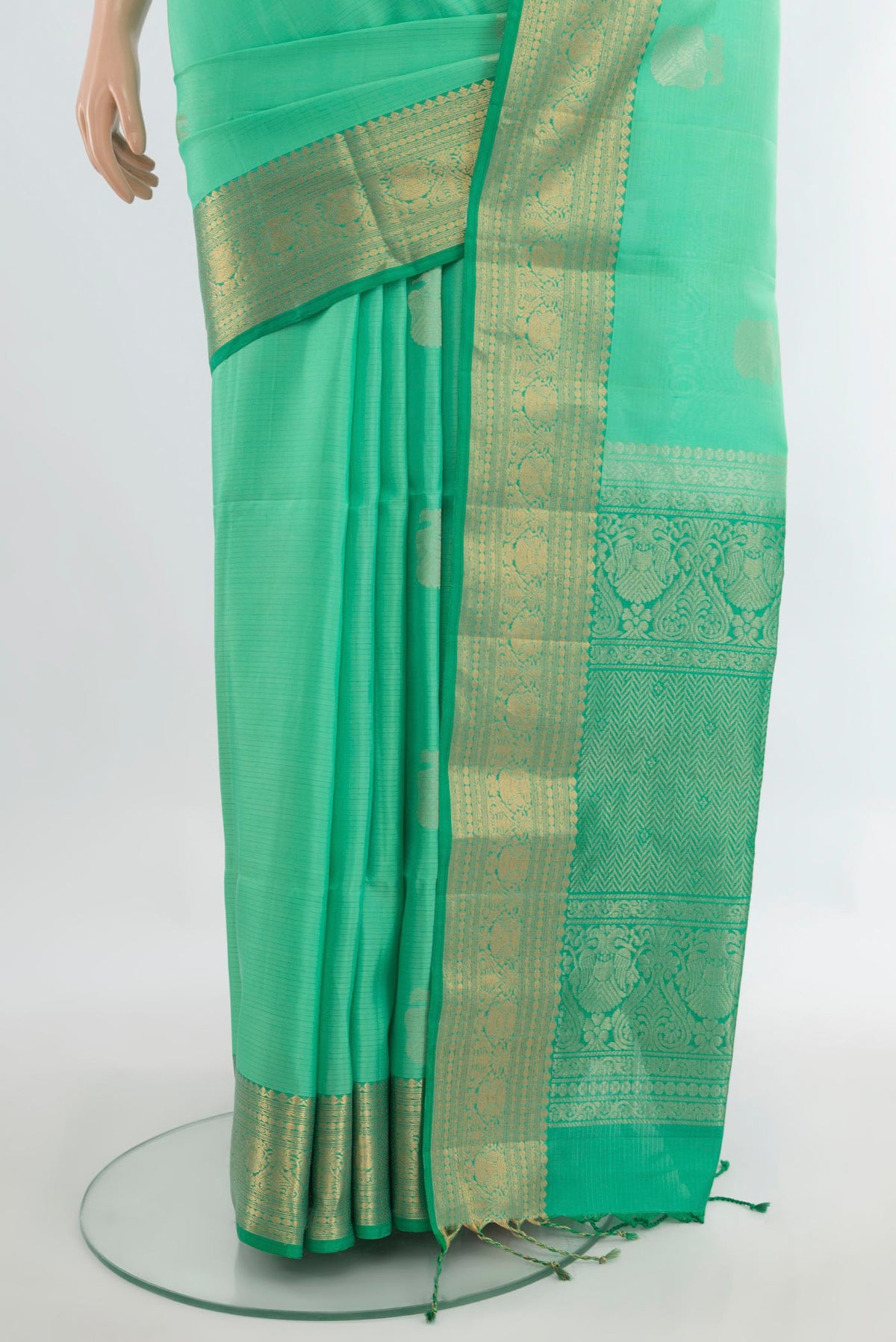 Pleats and pallu of Pure Silk Sea Green Soft Saree with Zari Butta on the body and Zari Border. 