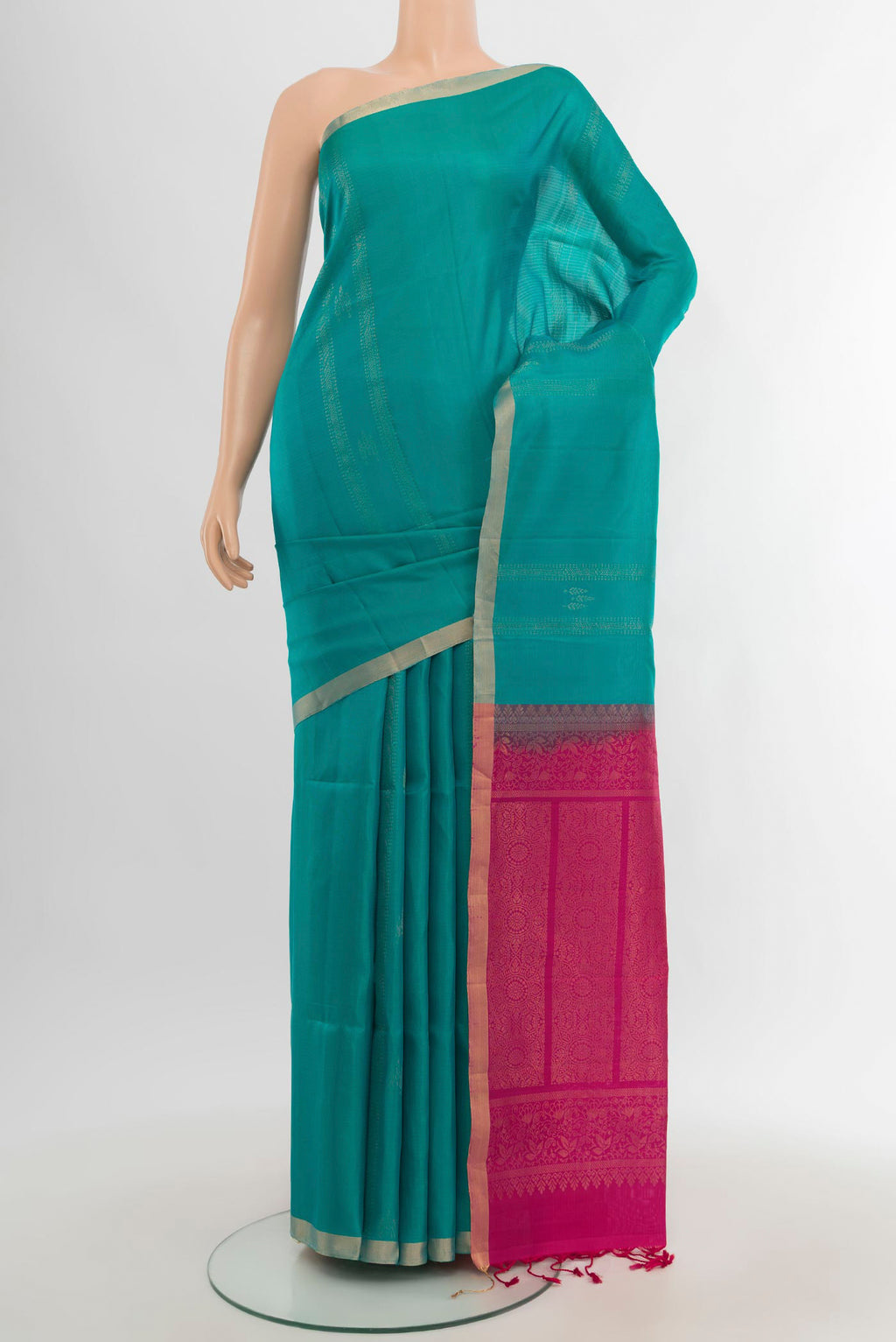 Peacock Blue Soft Silk Saree with Stripes on the body and Without Border.  displayed on a mannequin