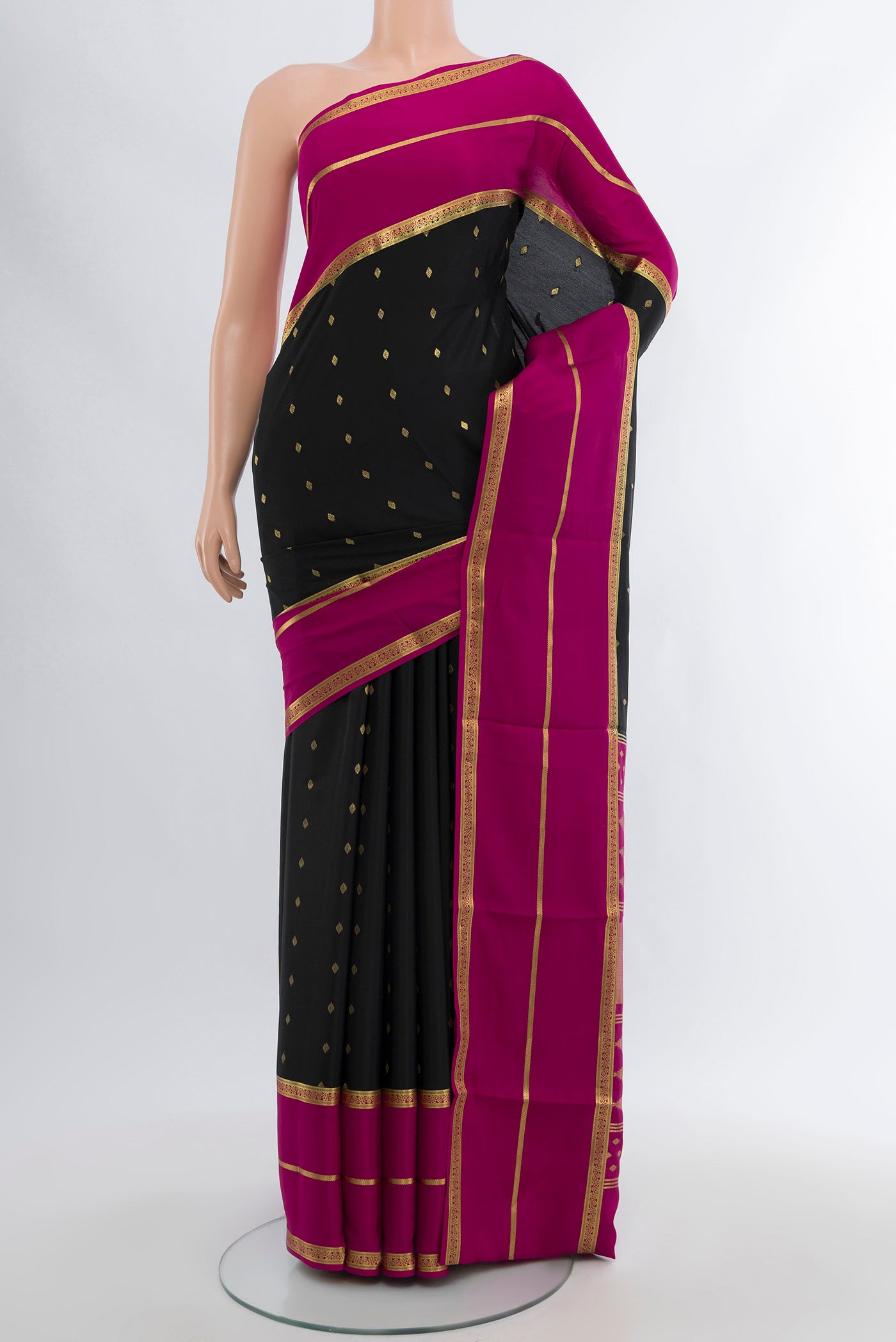 Black Mysore Crepe Saree with Zari Butta on the body and Silk Border.  displayed on a mannequin