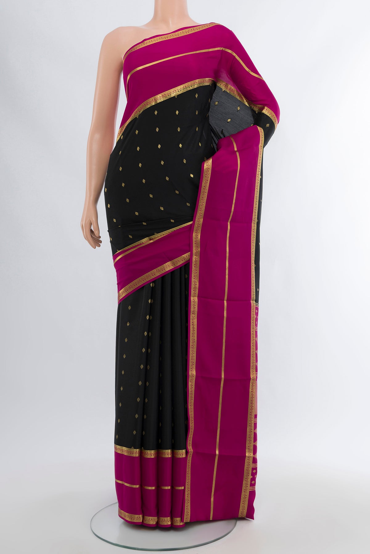 Black Mysore Crepe Saree with Zari Butta on the body and Silk Border.  displayed on a mannequin