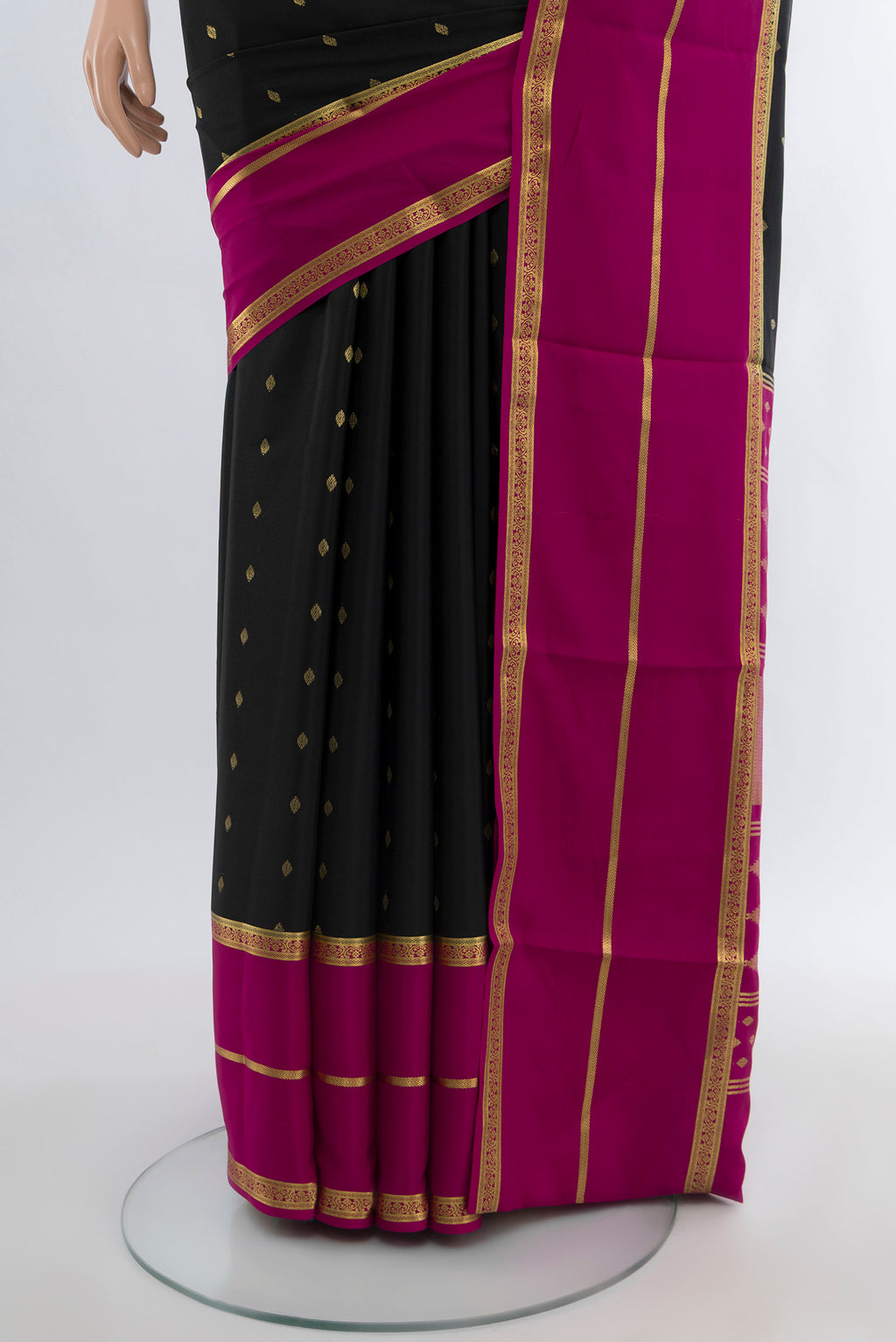 Pleats and pallu of Black Mysore Crepe Saree with Zari Butta on the body and Silk Border. 