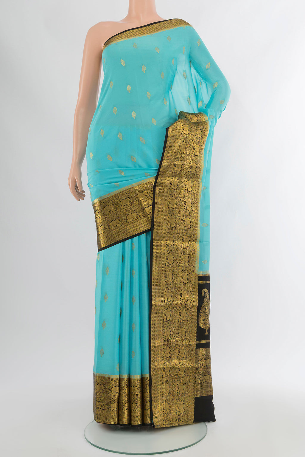 Sky Blue Mysore Crepe Saree with Zari Butta on the body and Zari Border.  displayed on a mannequin