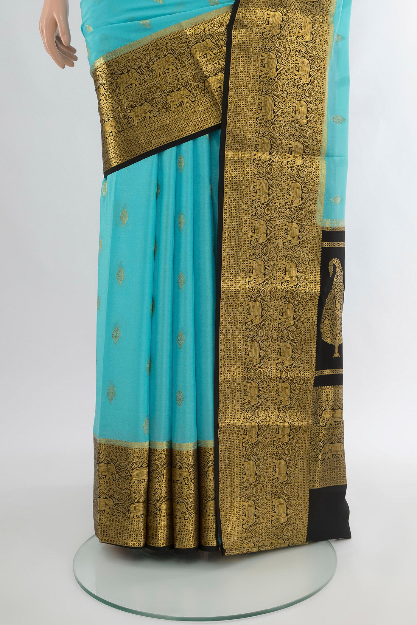 Pleats and pallu of Sky Blue Mysore Crepe Saree with Zari Butta on the body and Zari Border. 
