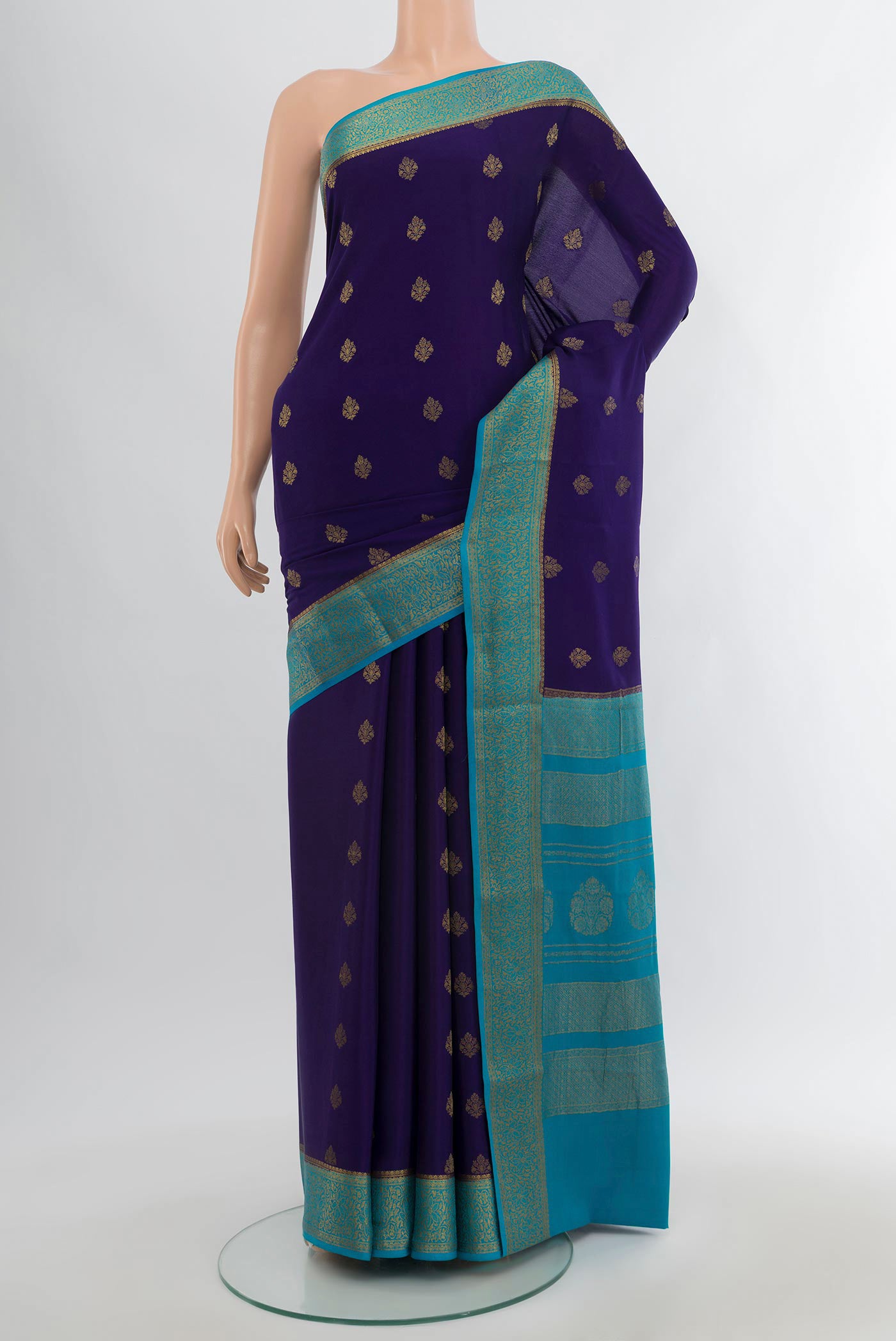 Navy Blue Mysore Crepe Saree with Zari Butta on the body and Zari Border.  displayed on a mannequin