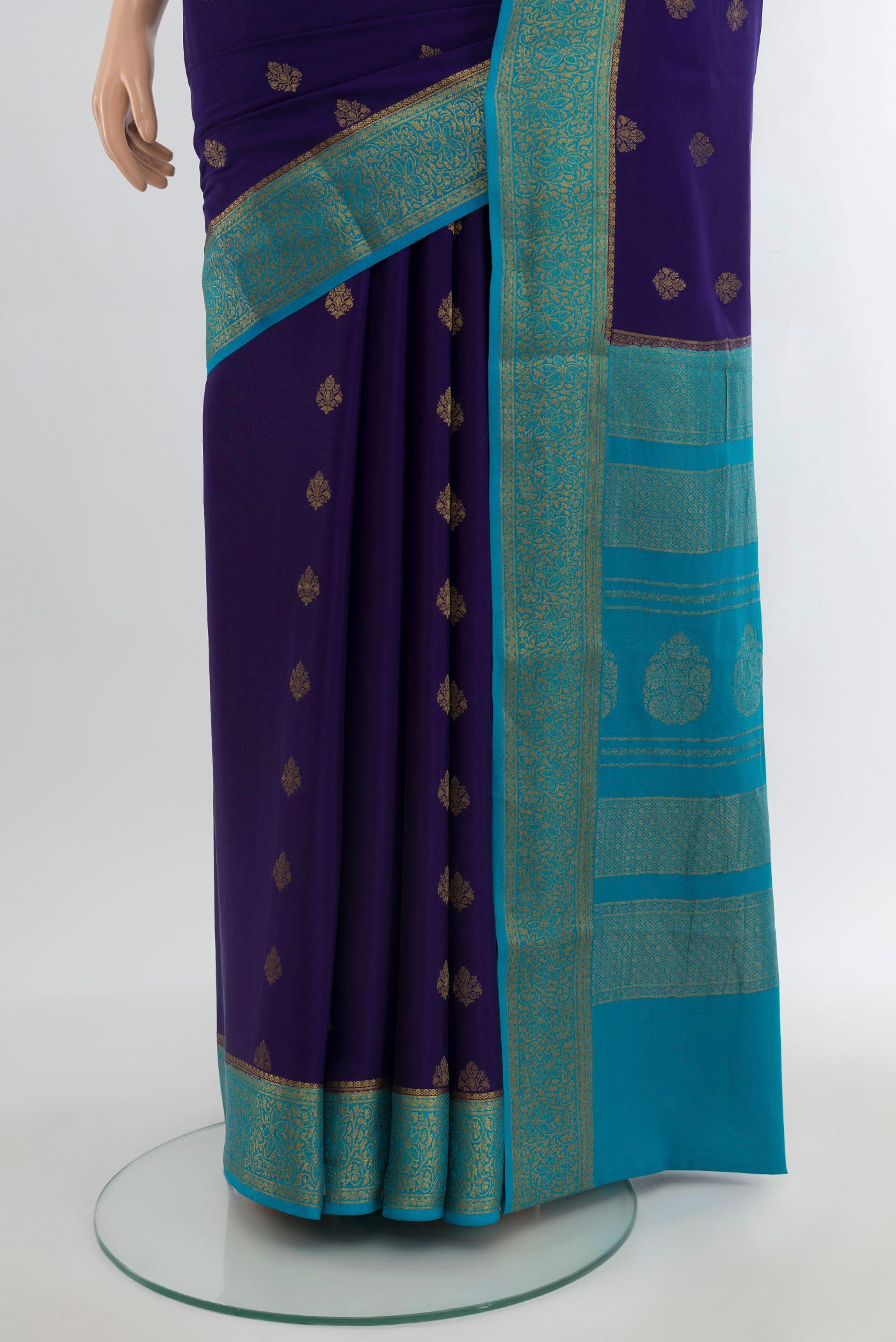 Pleats and pallu of Navy Blue Mysore Crepe Saree with Zari Butta on the body and Zari Border. 