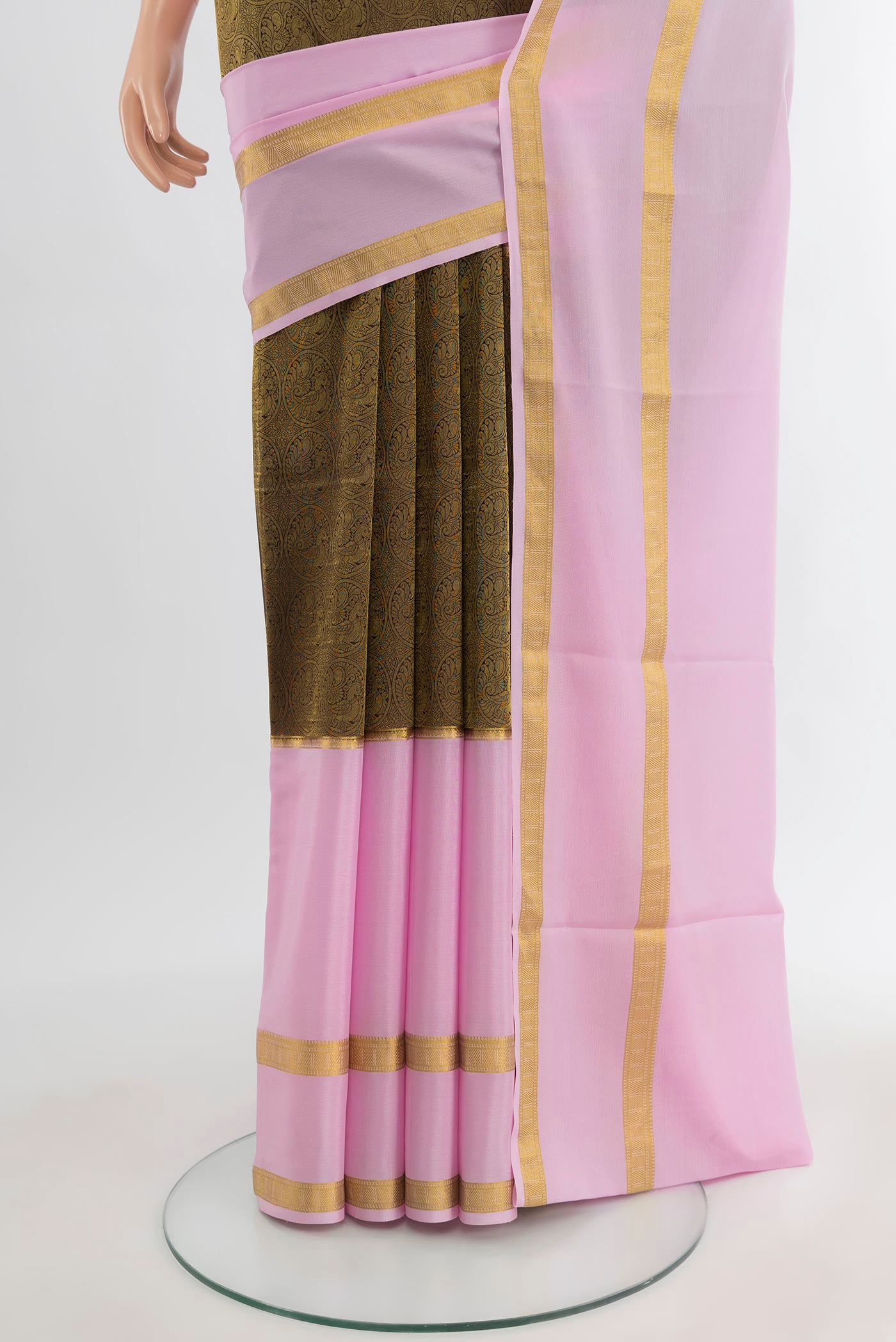 Pleats and pallu of Brown Mysore Crepe Saree with Zari Brocade on the body and Zari Border. 
