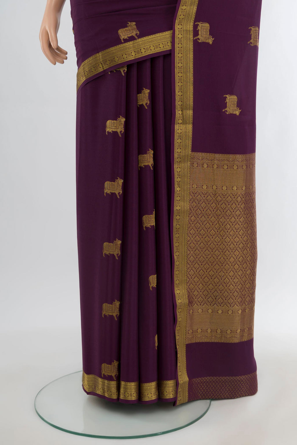 Pleats and pallu of Purple Mysore Crepe Saree with Zari Butta on the body and Zari Border. 