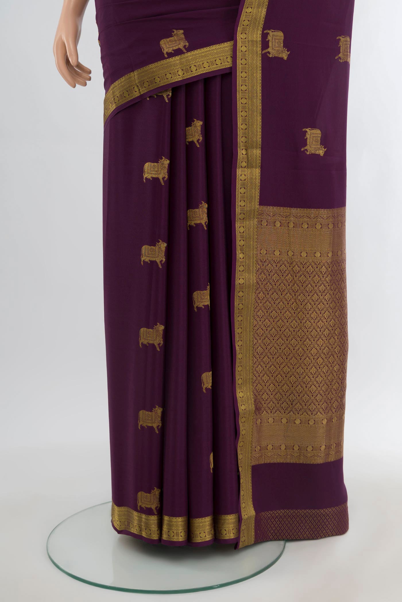Pleats and pallu of Purple Mysore Crepe Saree with Zari Butta on the body and Zari Border. 