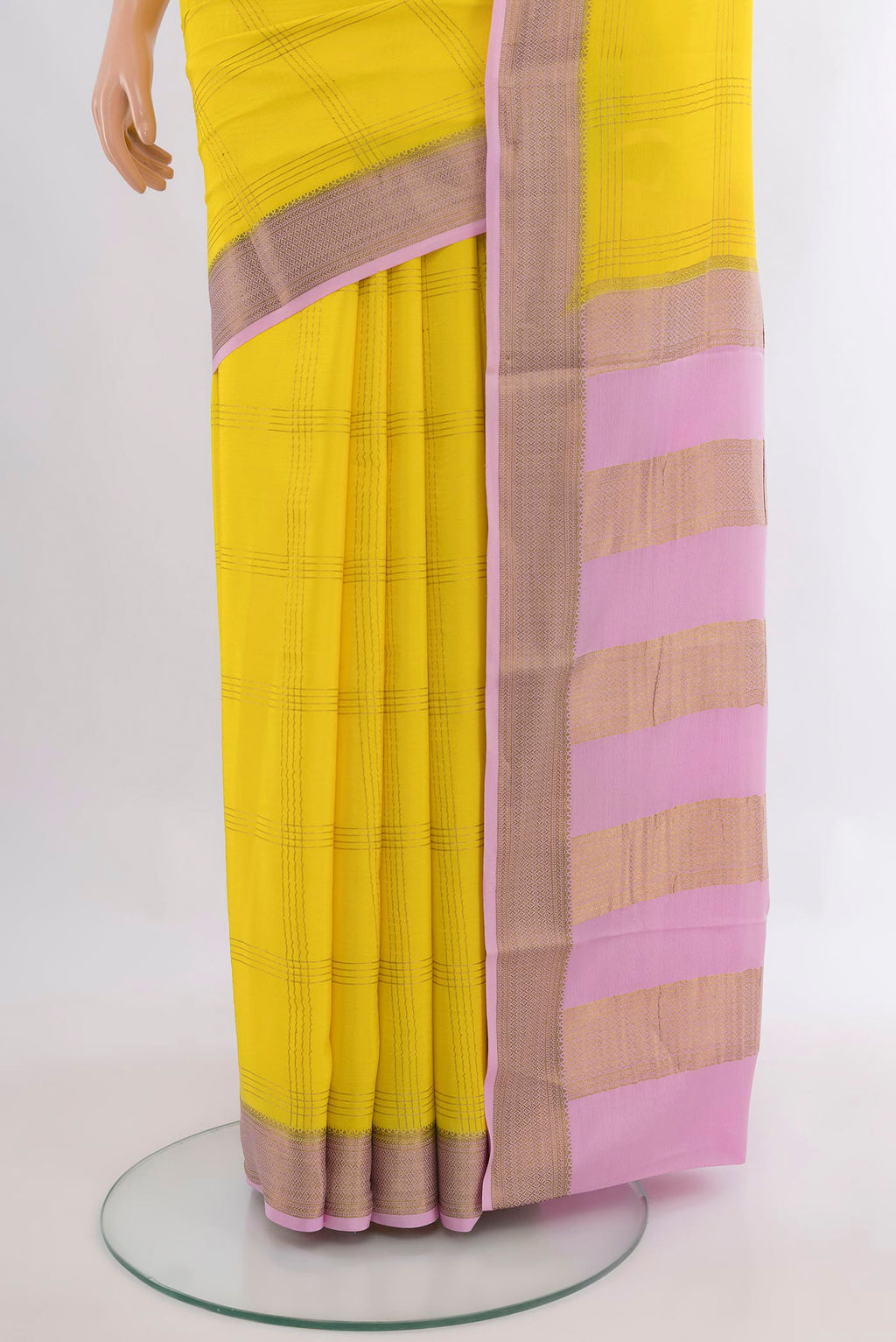 Pleats and pallu of Lemon Yellow Mysore Crepe Saree with Checked design on the body and Zari Border. 