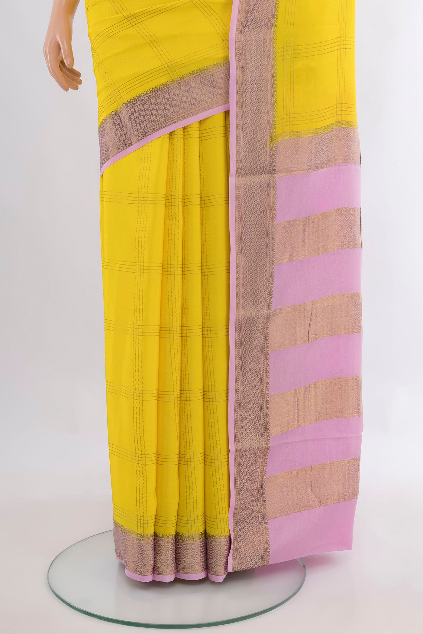 Pleats and pallu of Lemon Yellow Mysore Crepe Saree with Checked design on the body and Zari Border. 