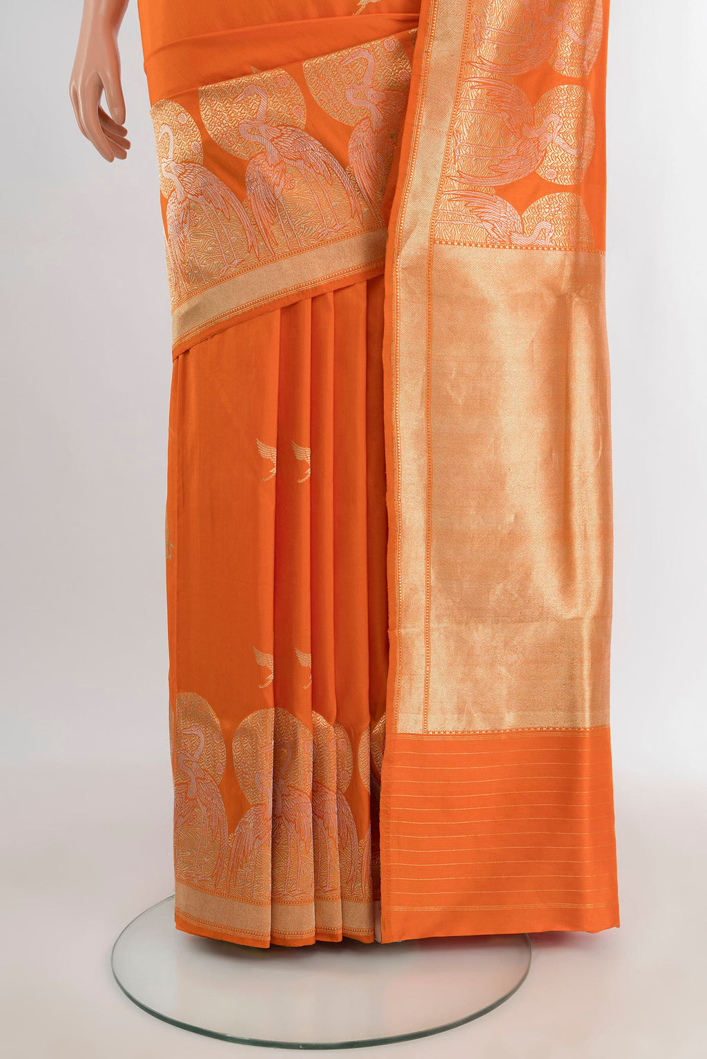 Pleats and pallu of Orange Banarasi Silk Saree with Zari Butta on the body and Fancy Border. 
