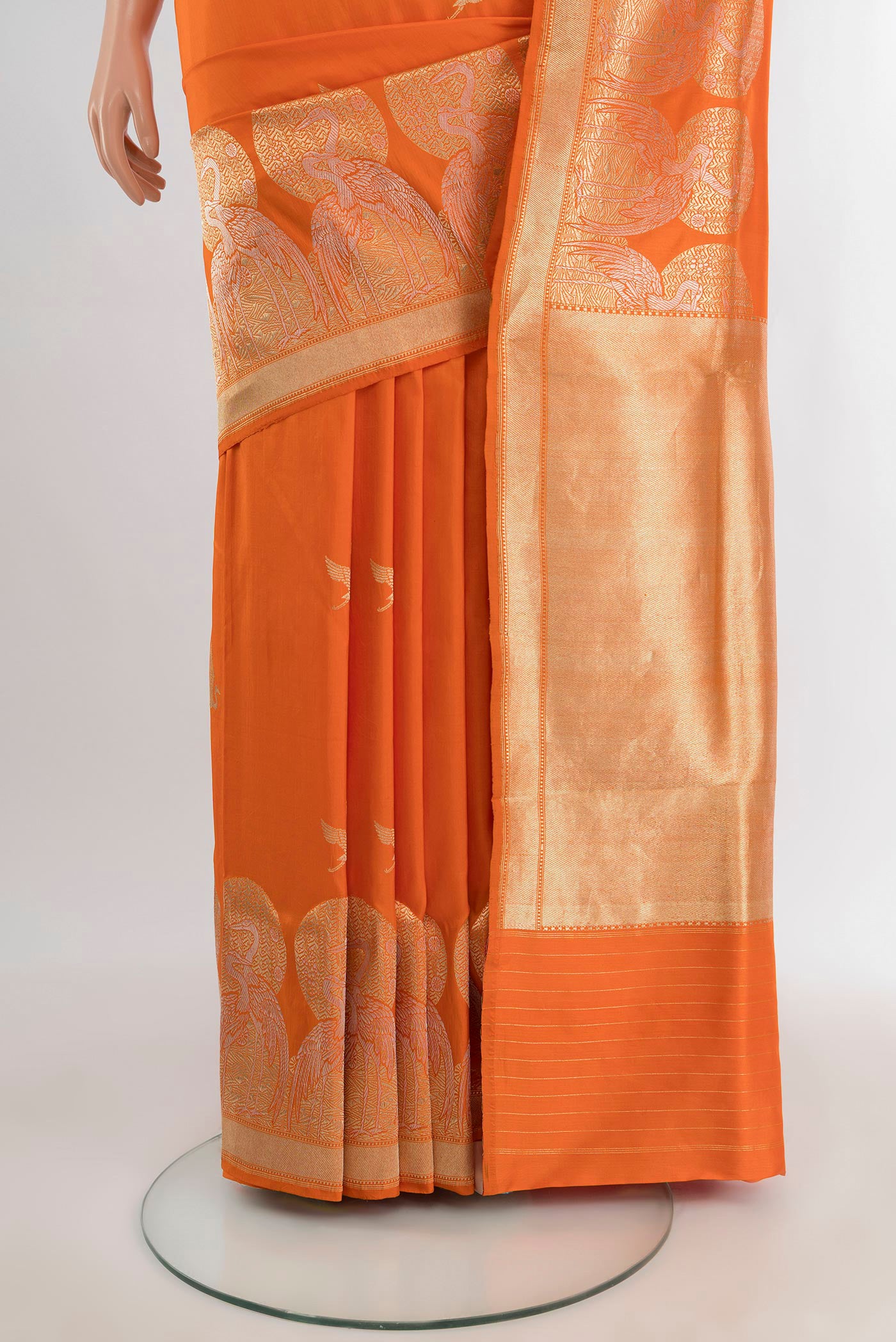 Pleats and pallu of Orange Banarasi Silk Saree with Zari Butta on the body and Fancy Border. 