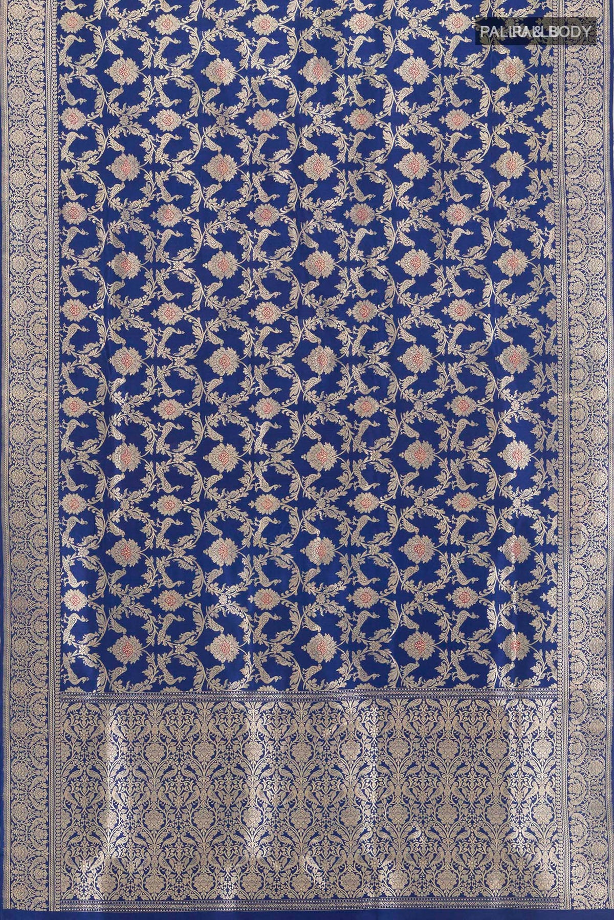 Flat view of Pure Silk Blue Banarasi Saree with Zari Brocade on the body and Zari Border. 