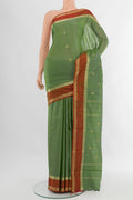 Light Green Bangalore Silk Saree with Zari Butta on the body and Zari Border.  displayed on a mannequin