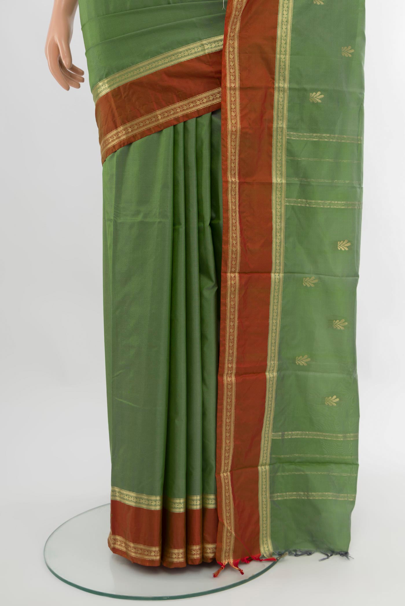 Pleats and pallu of Light Green Bangalore Silk Saree with Zari Butta on the body and Zari Border. 