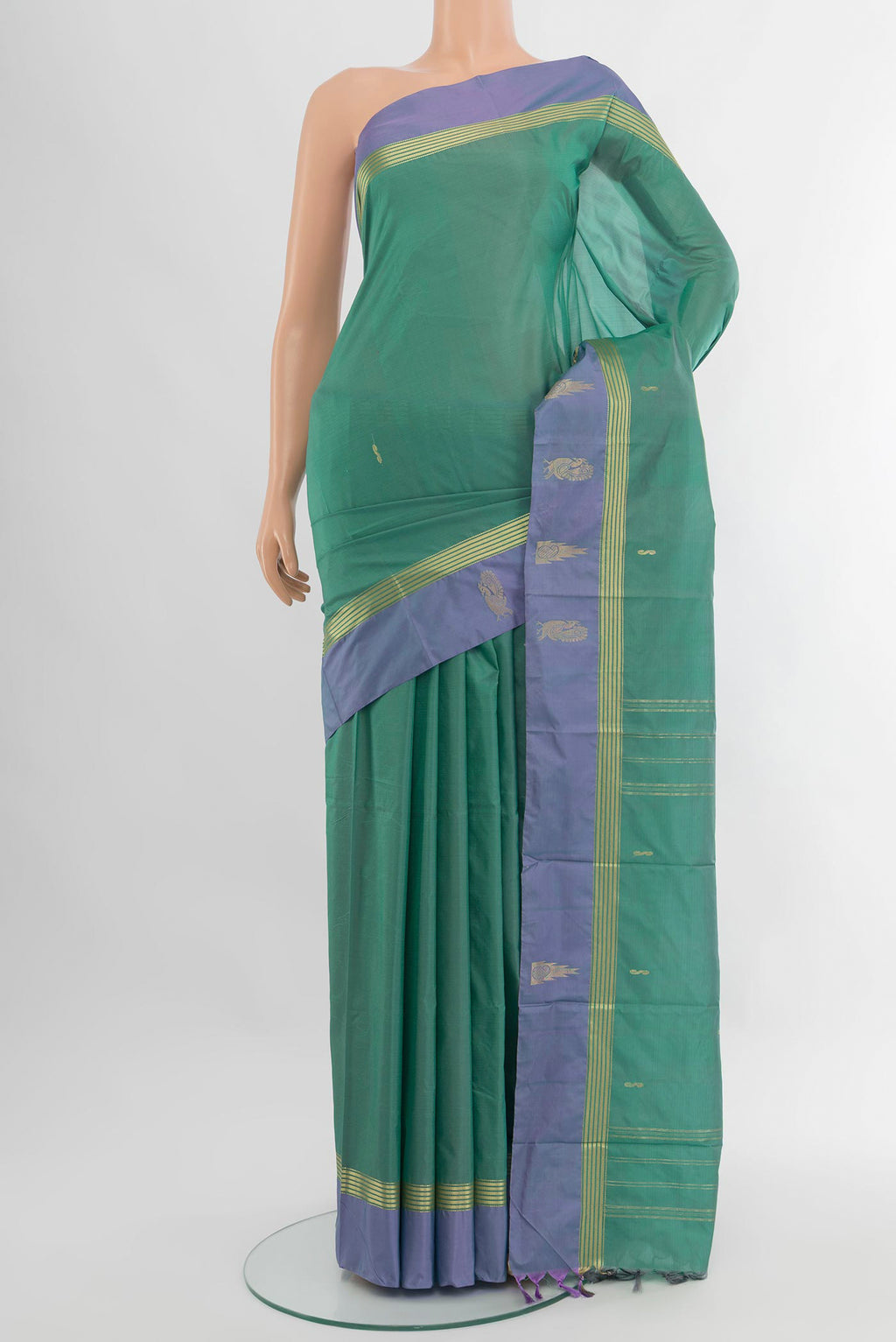 Teal Kanjivaram Silk Saree with Zari Butta on the body and Plain Border.  displayed on a mannequin