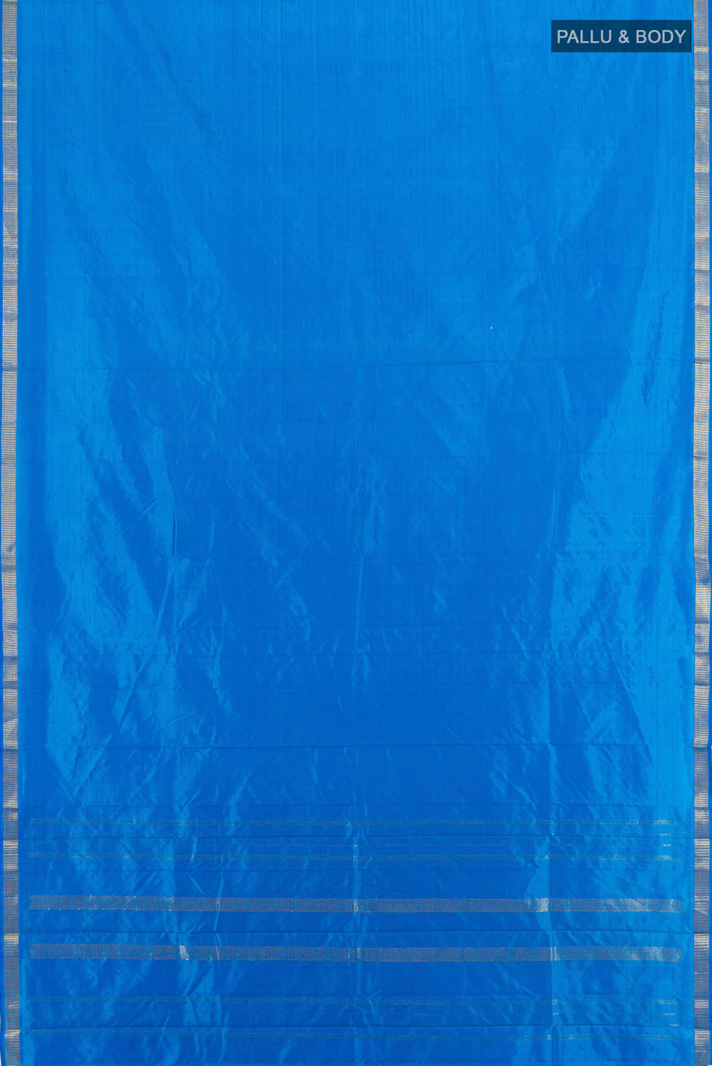 Flat view of Light Blue Kanchipuram Silk Saree with Plain Body and Zari Border. 