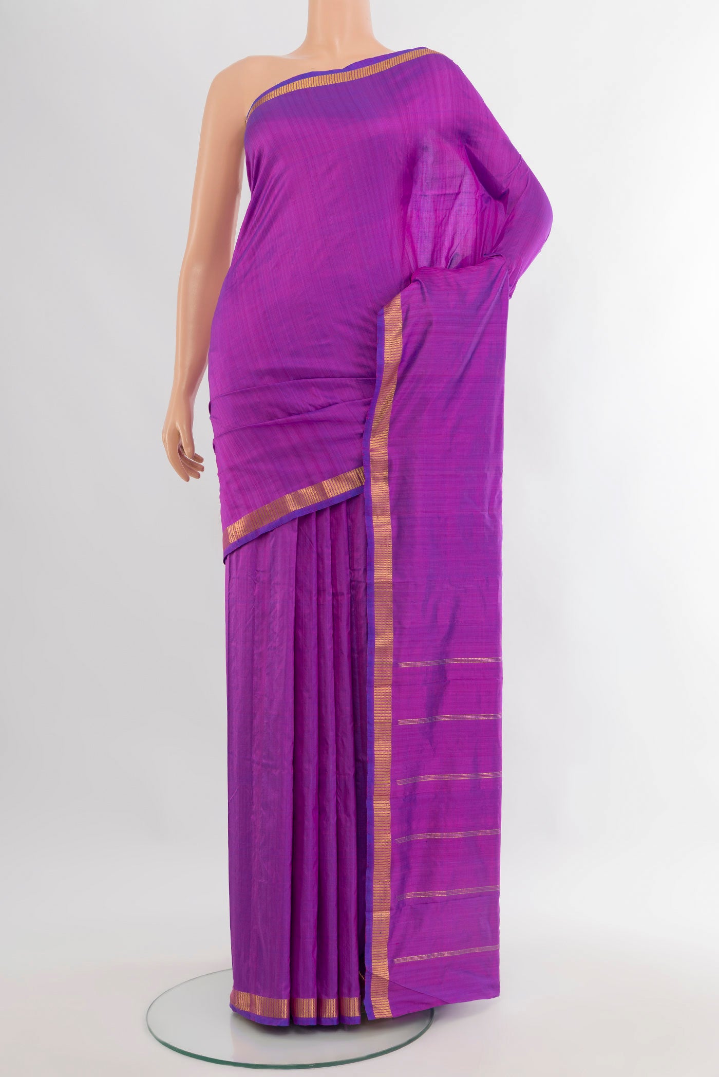 Purple Kanchipuram Silk Saree with Plain Body and Zari Border.  displayed on a mannequin