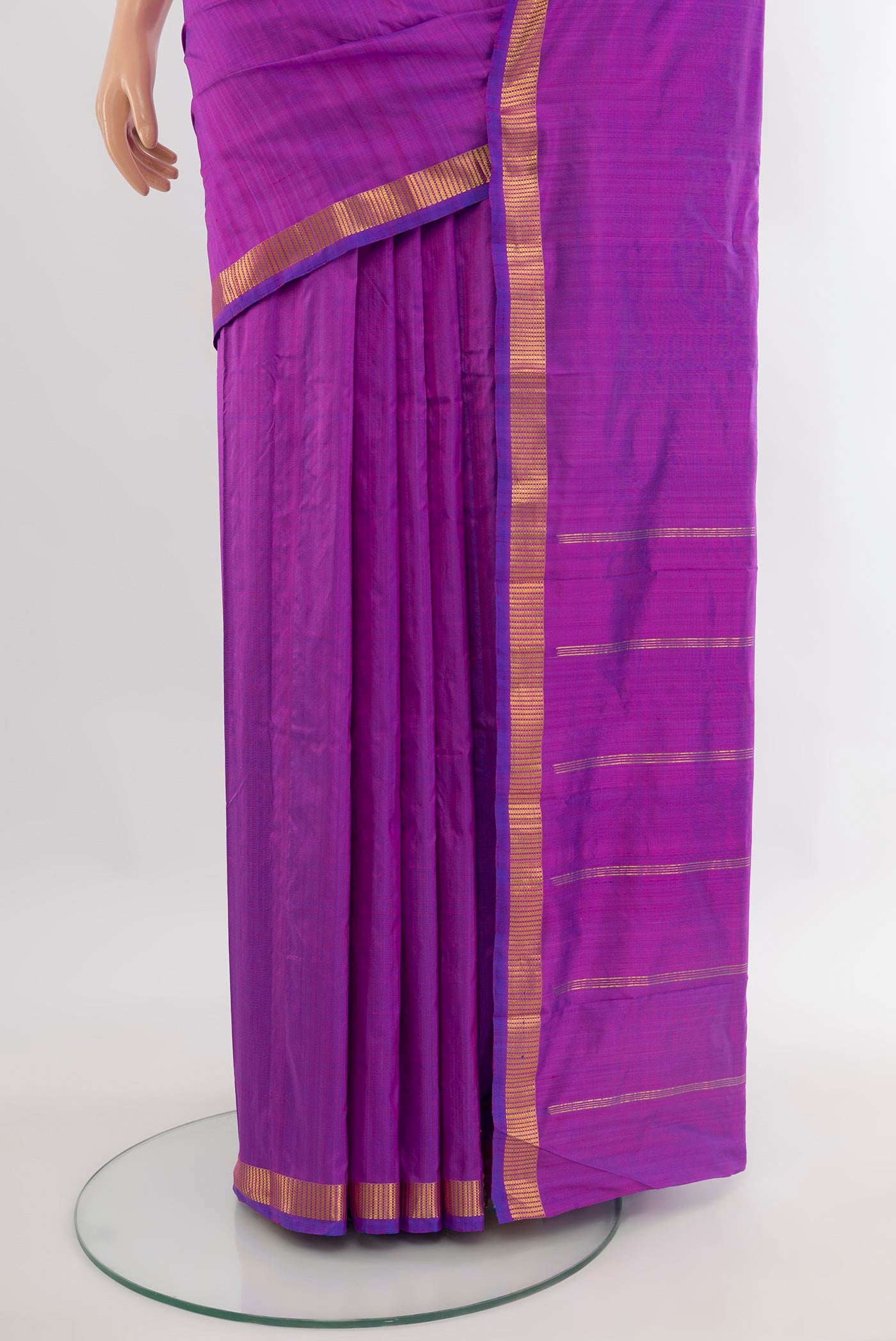 Pleats and pallu of Purple Kanchipuram Silk Saree with Plain Body and Zari Border. 