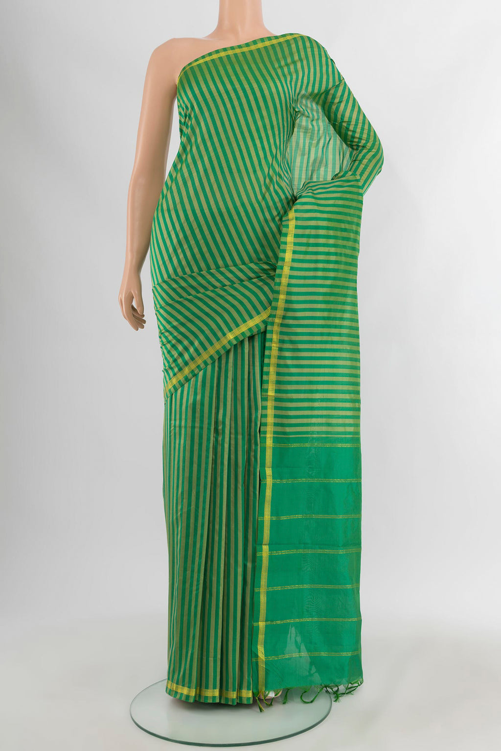 Light Green Kanchipuram Silk Saree with Stripes on the body and Zari Border.  displayed on a mannequin