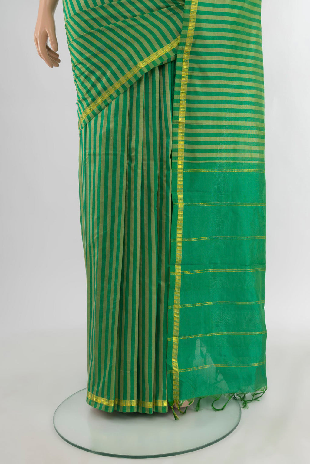Pleats and pallu of Light Green Kanchipuram Silk Saree with Stripes on the body and Zari Border. 