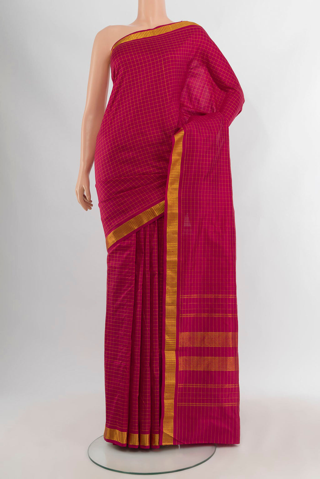 Maroon Kanjivaram Silk Saree with Checked design on the body and Zari Border.  displayed on a mannequin
