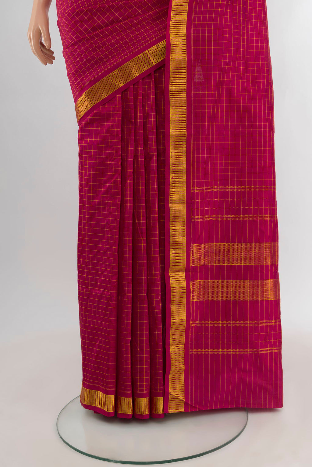 Pleats and pallu of Maroon Kanjivaram Silk Saree with Checked design on the body and Zari Border. 