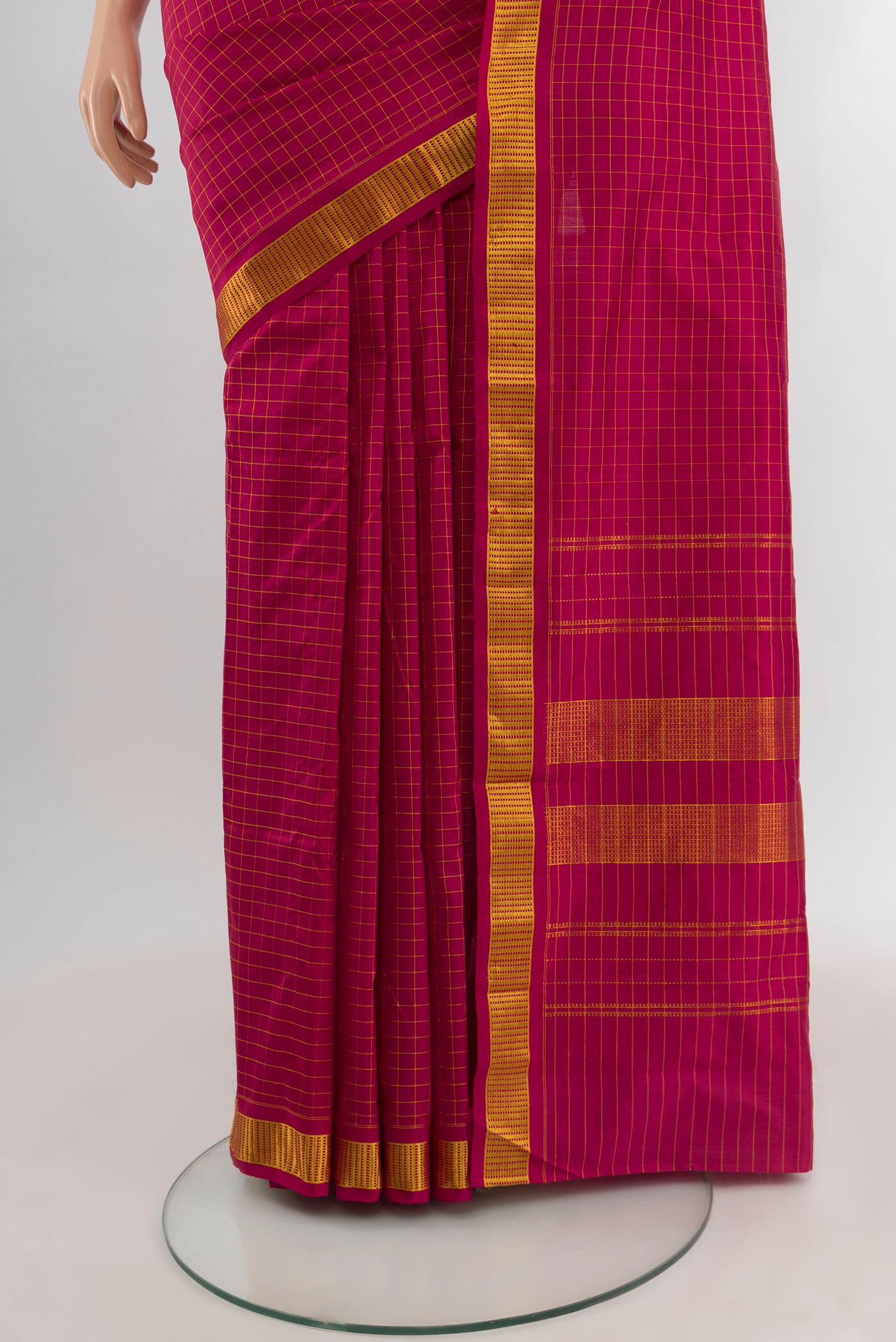 Pleats and pallu of Maroon Kanjivaram Silk Saree with Checked design on the body and Zari Border. 