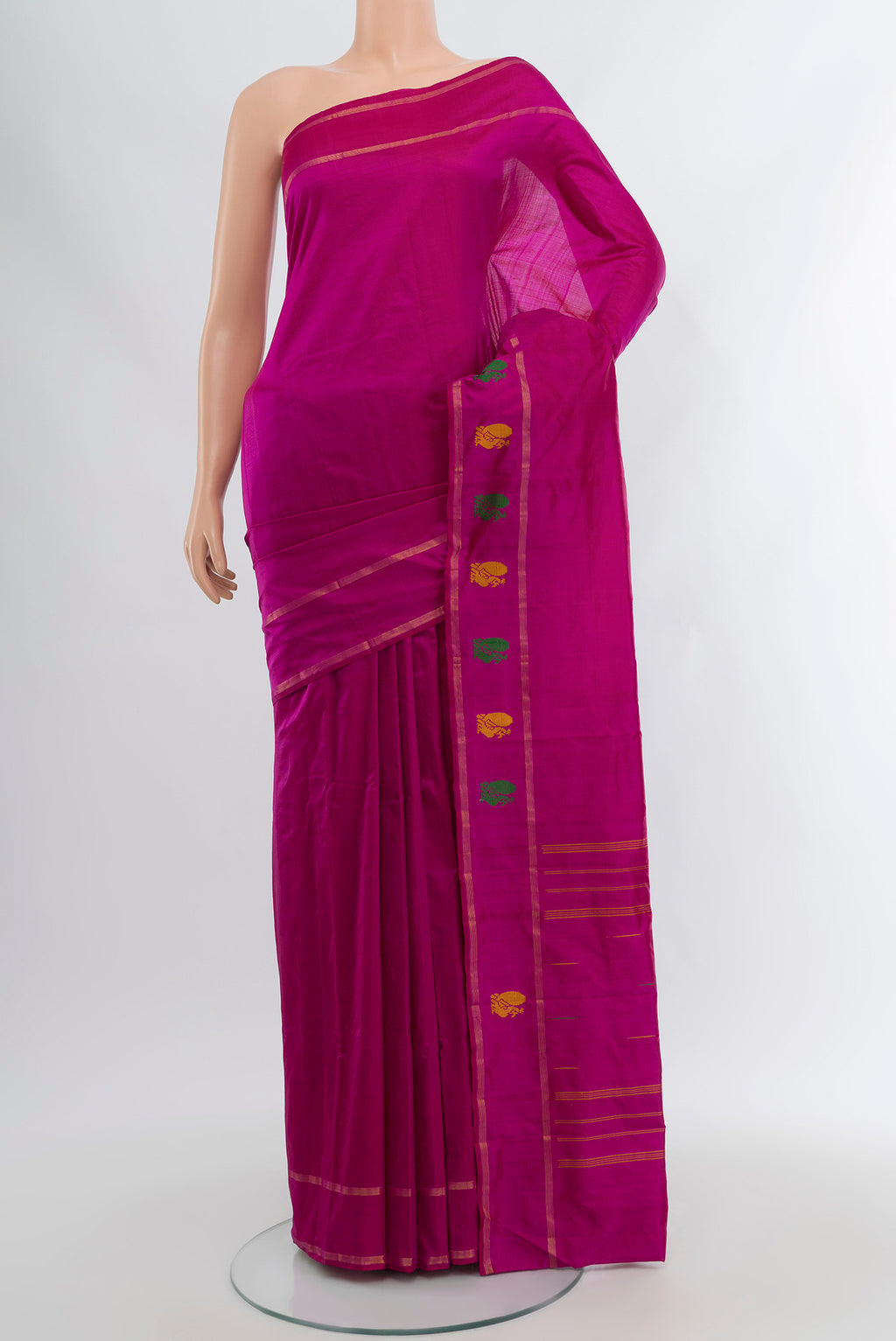 Magenta Kanchipuram Silk Saree with Plain Body and Zari Border.  displayed on a mannequin