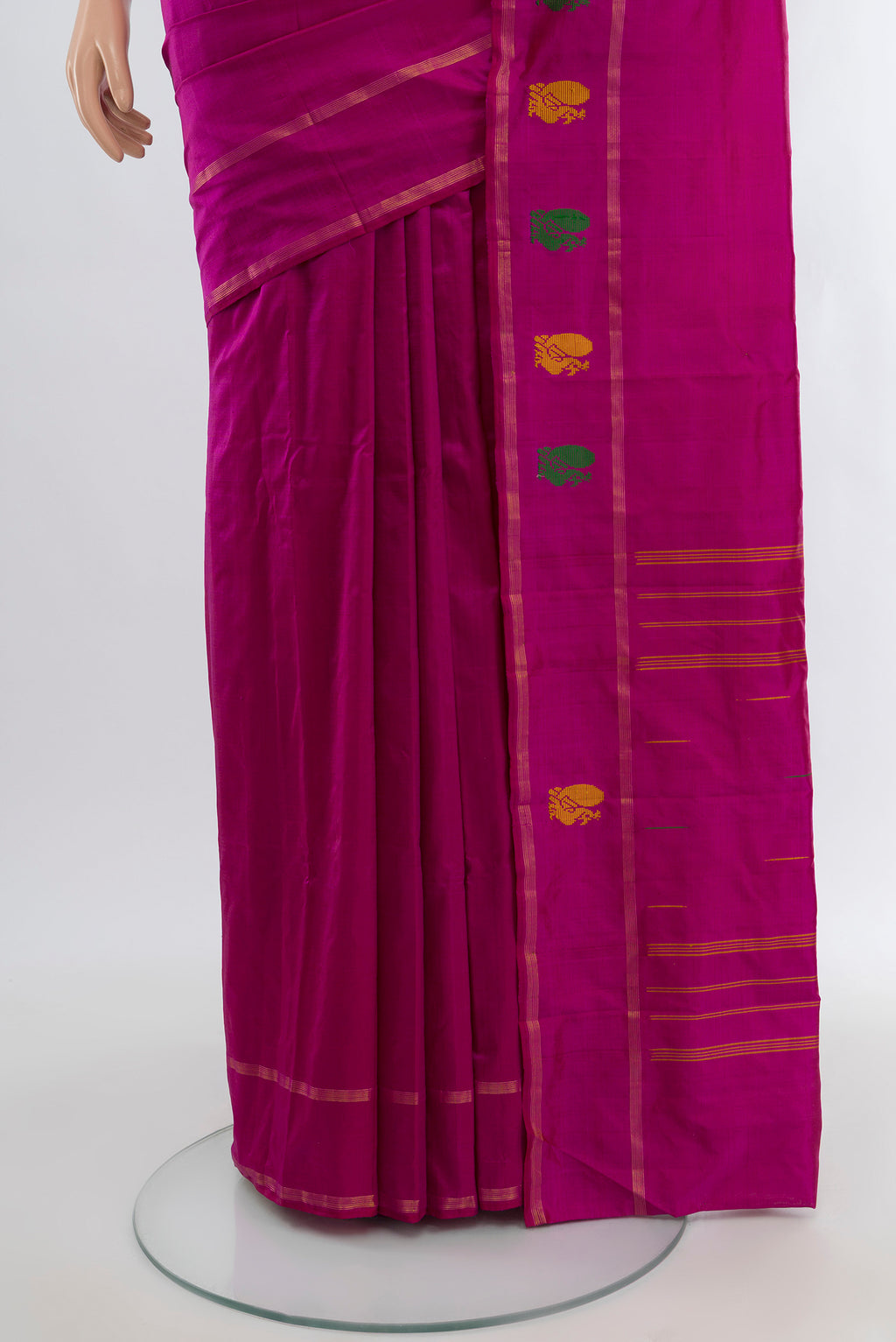 Pleats and pallu of Magenta Kanchipuram Silk Saree with Plain Body and Zari Border. 