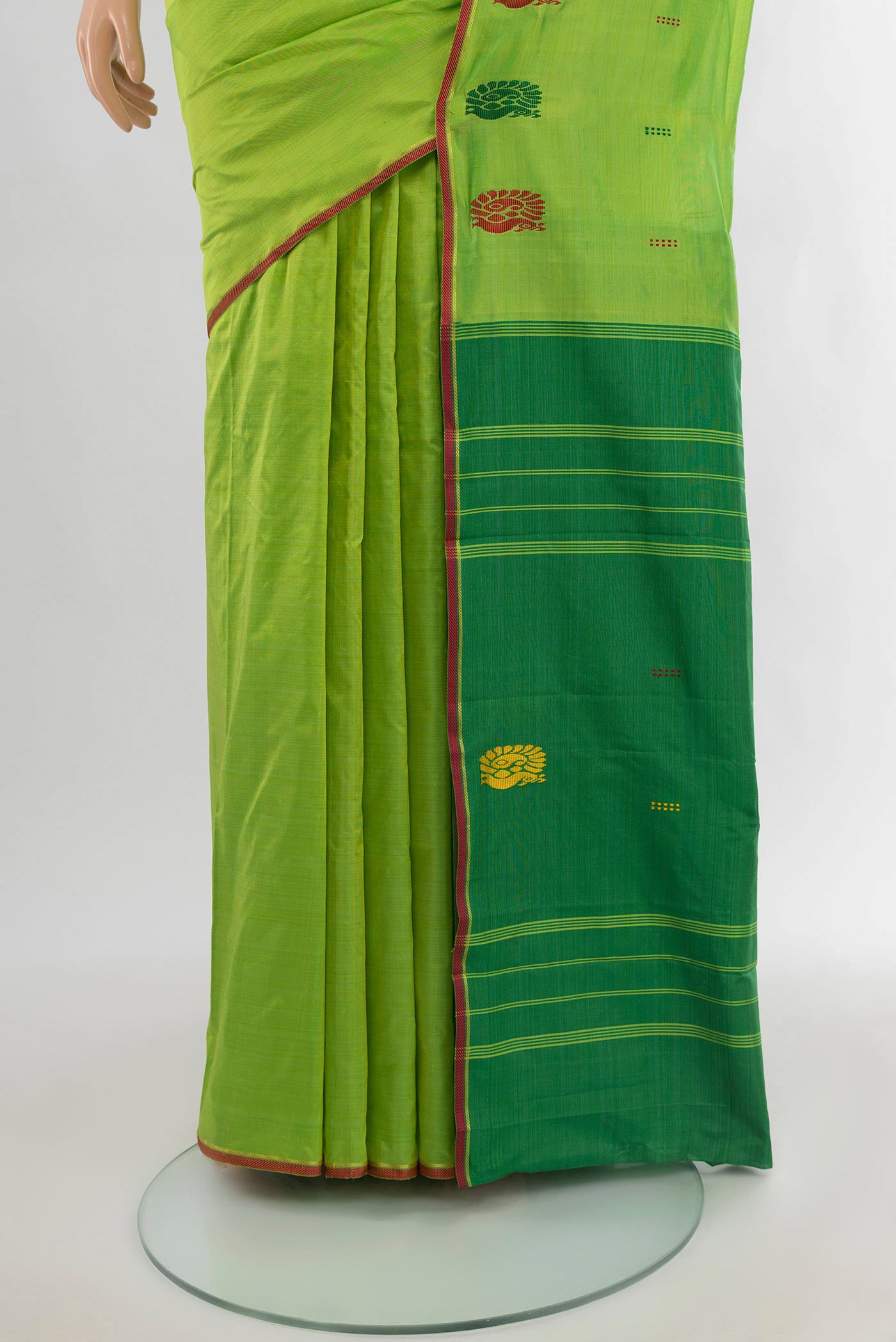 Pleats and pallu of Parrot Green Kanchipuram Silk Saree with Thread Butta on the body and Thread Border. 