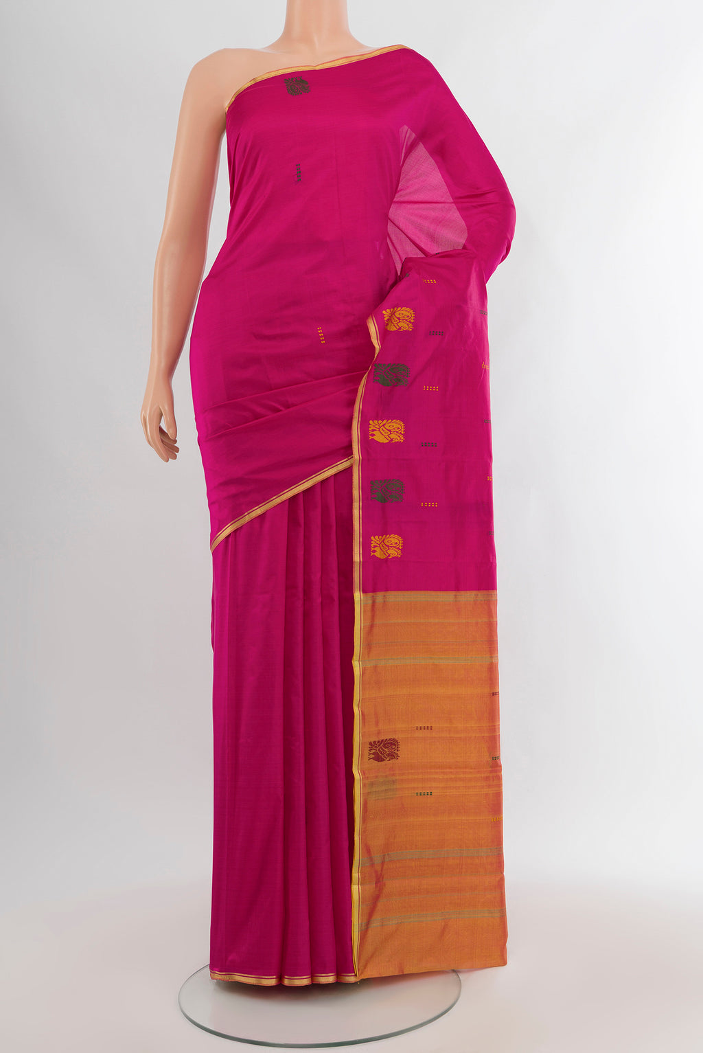 Magenta Kanchipuram Silk Saree with Thread Butta on the body and Thread Border.  displayed on a mannequin