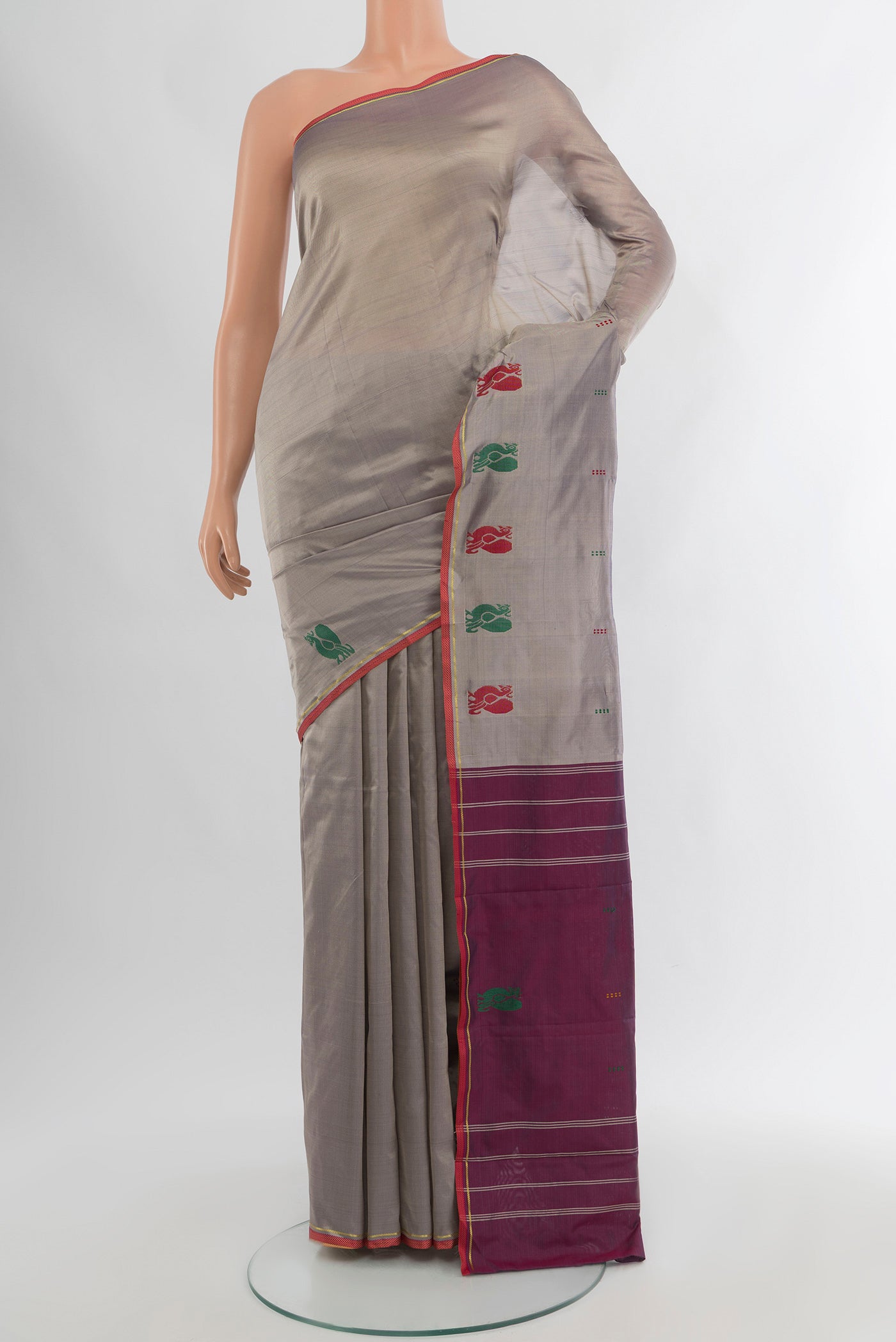 Grey Kanchipuram Silk Saree with Plain Body and Thread Border.  displayed on a mannequin