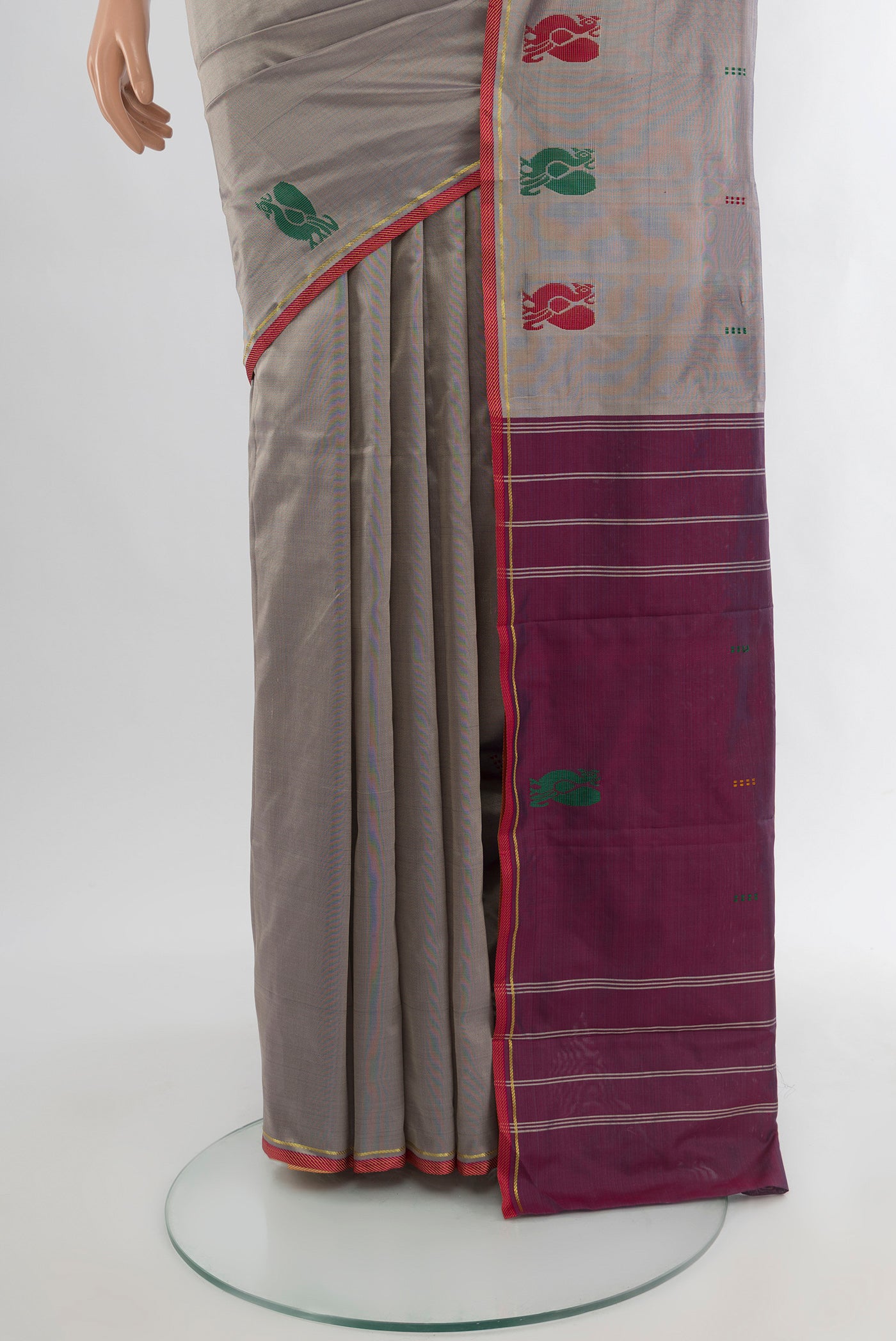 Pleats and pallu of Grey Kanchipuram Silk Saree with Plain Body and Thread Border. 